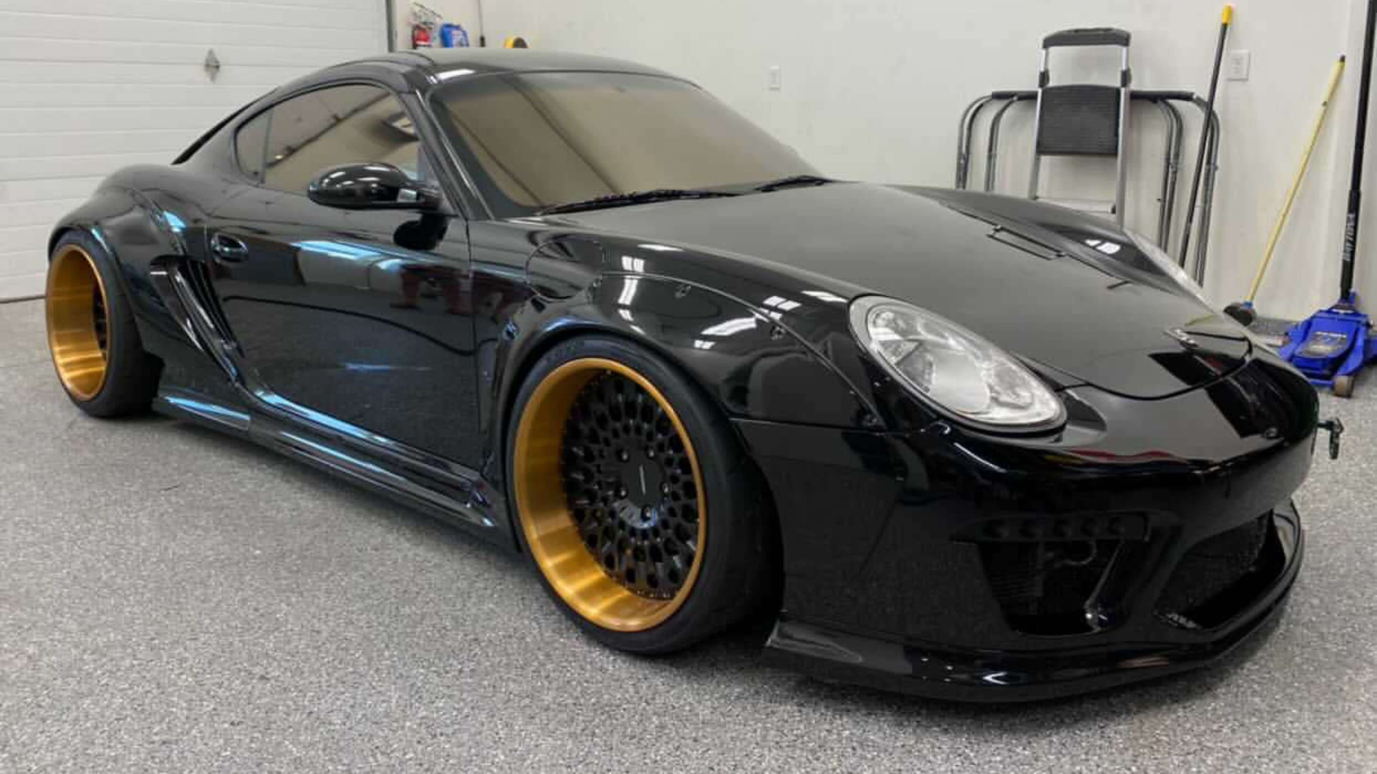 Black car with 35% window tint offering style and privacy in a garage.