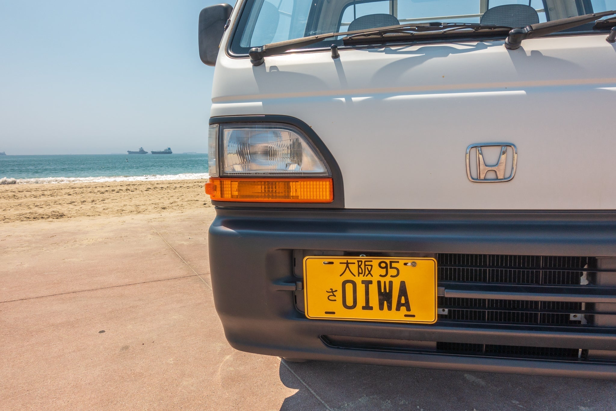 White Honda Acty featuring custom Oiwa Garage license plate
