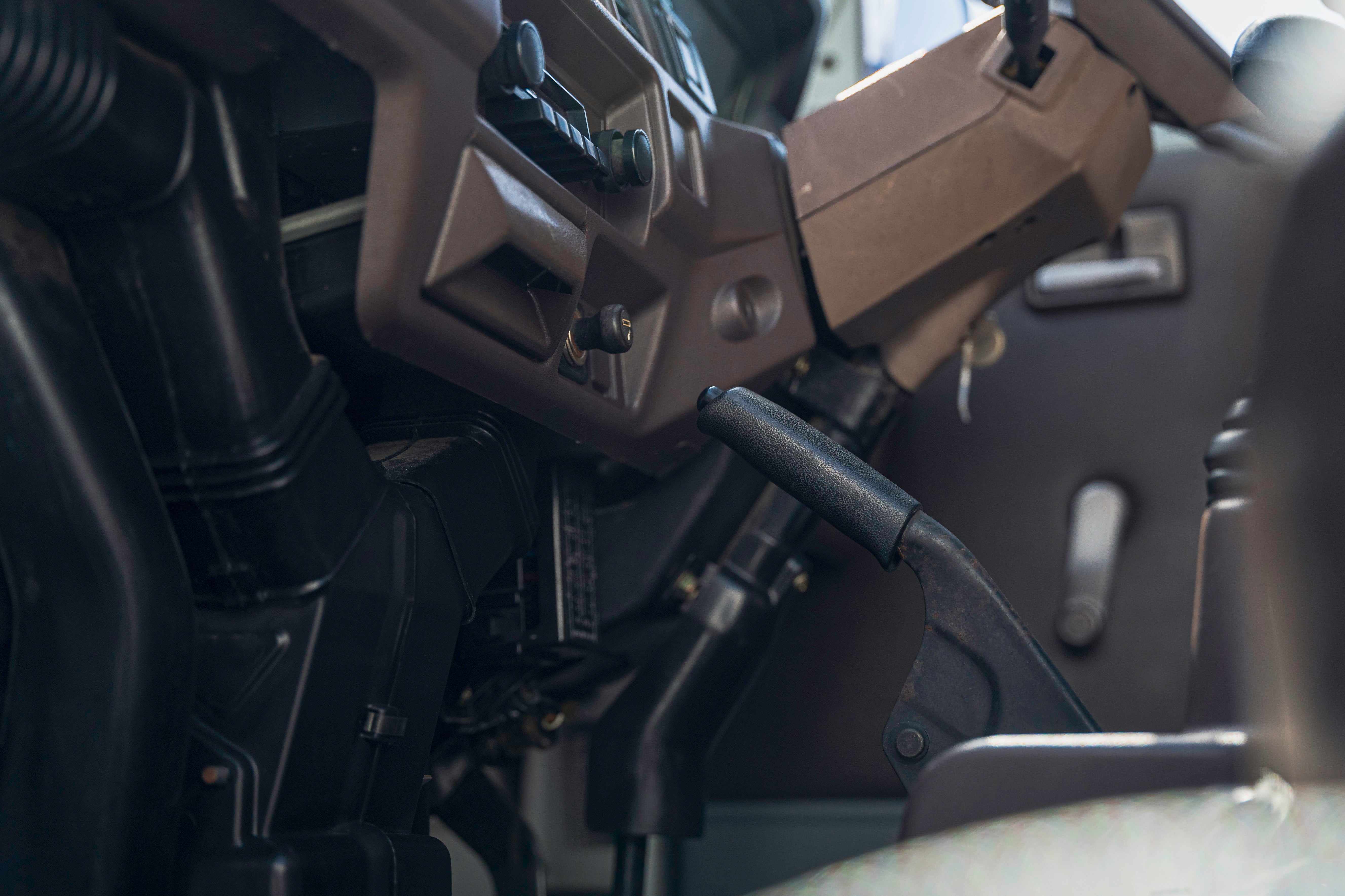 Close-up view of a vehicle's interior, focusing on the dashboard and gear lever.