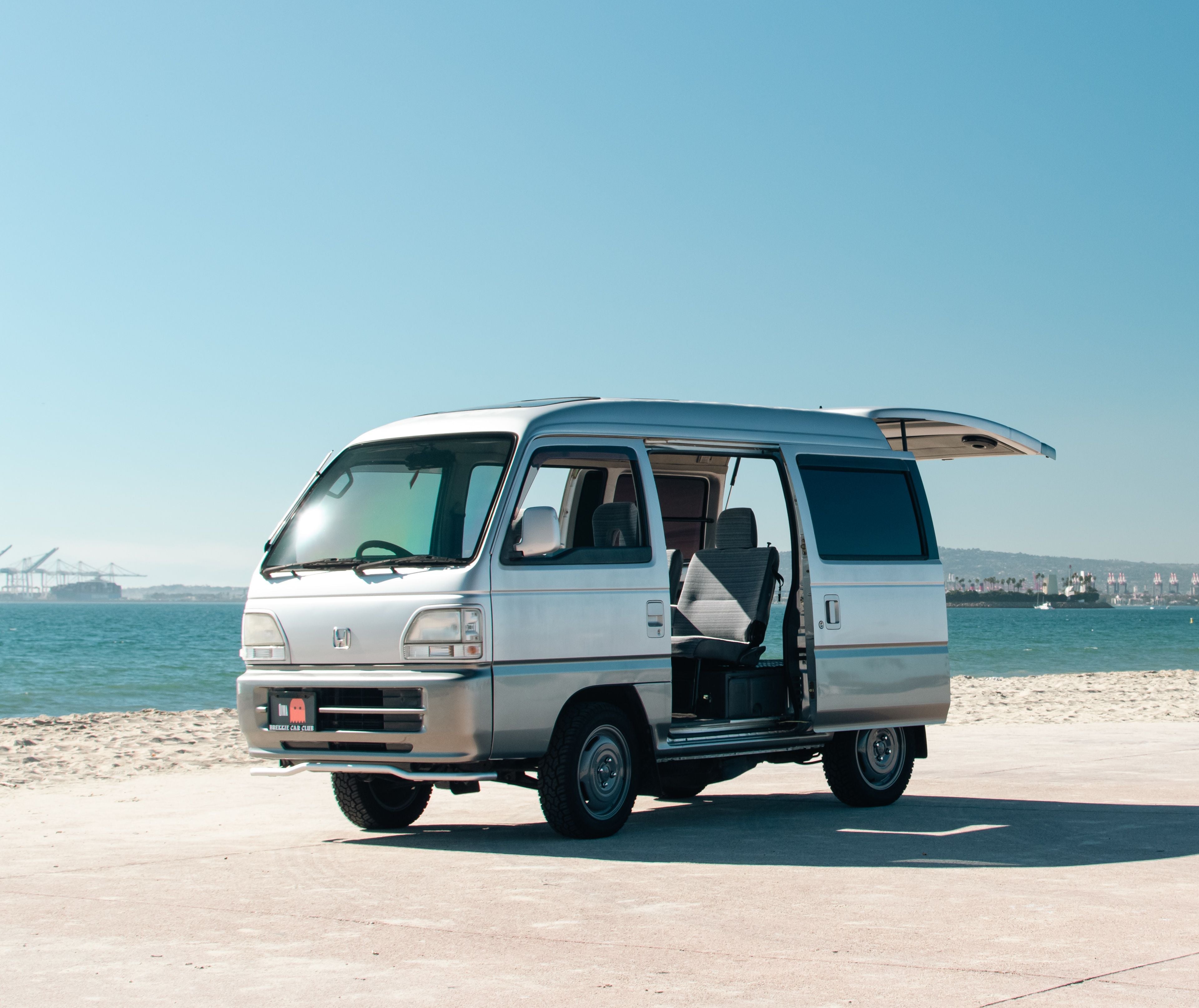 Honda Street Van parked seaside showcasing open sliding door and hatch