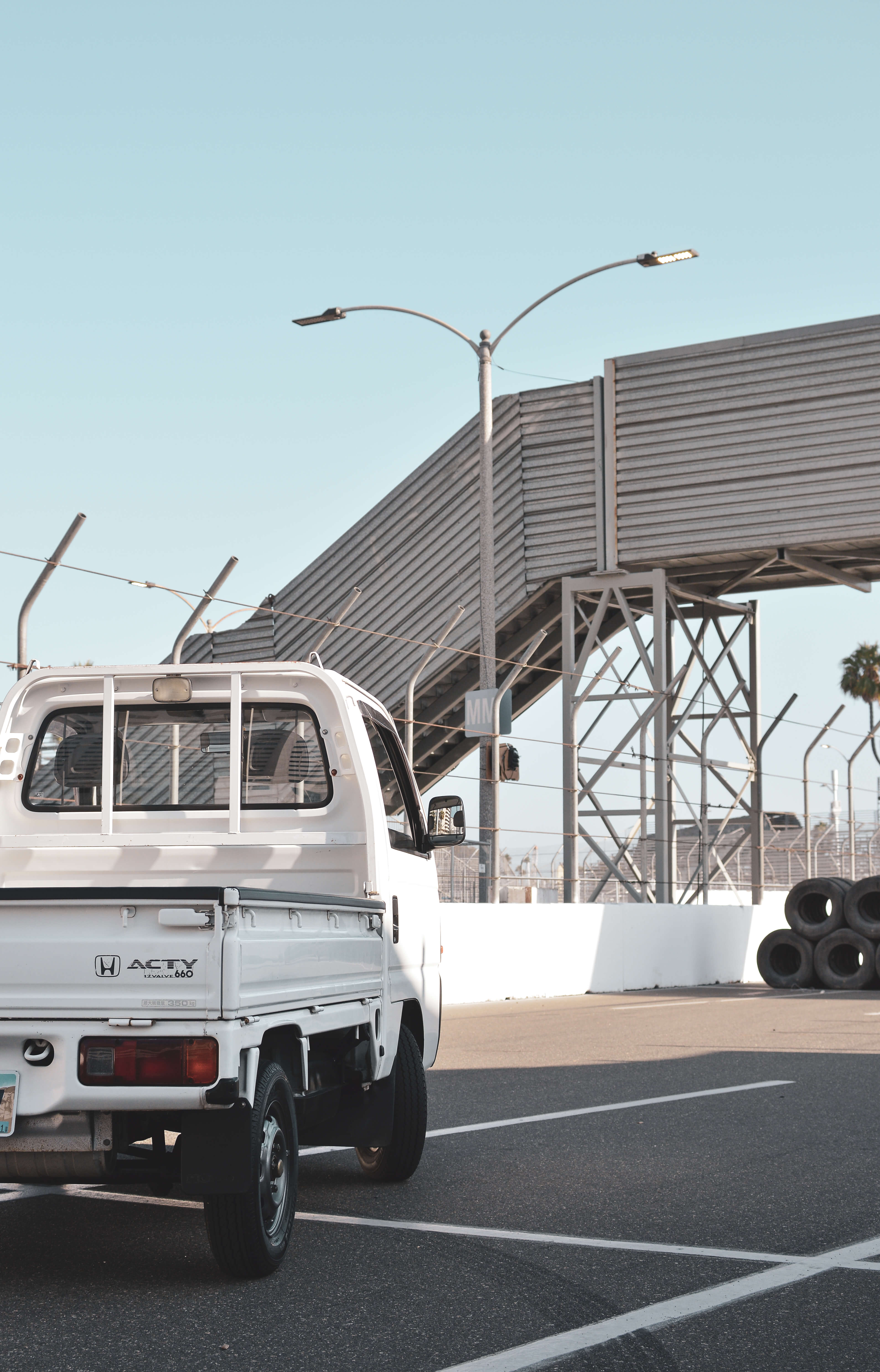 Subaru Sambar Supercharged kei truck showcasing its unique design and power, symbolizing Japanese automotive innovation.