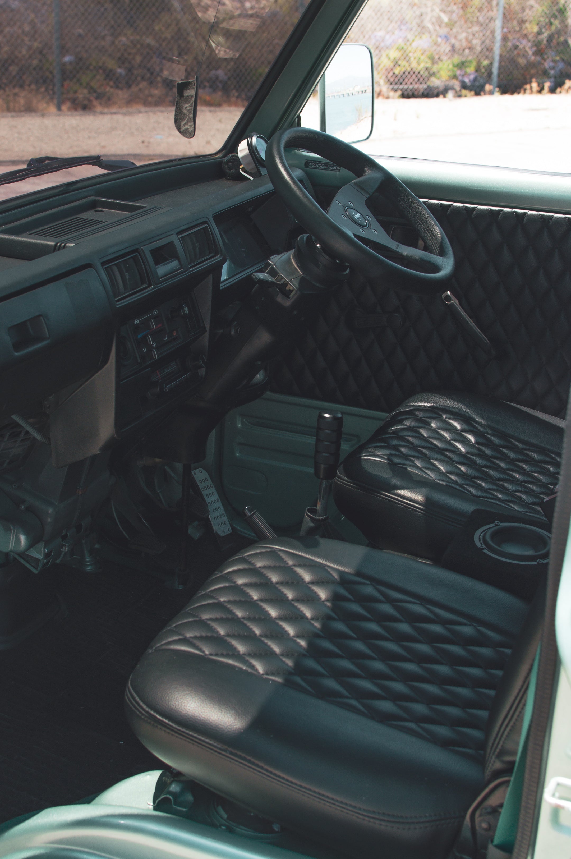 Offroad kei truck in rugged terrain showcasing Japanese engineering prowess