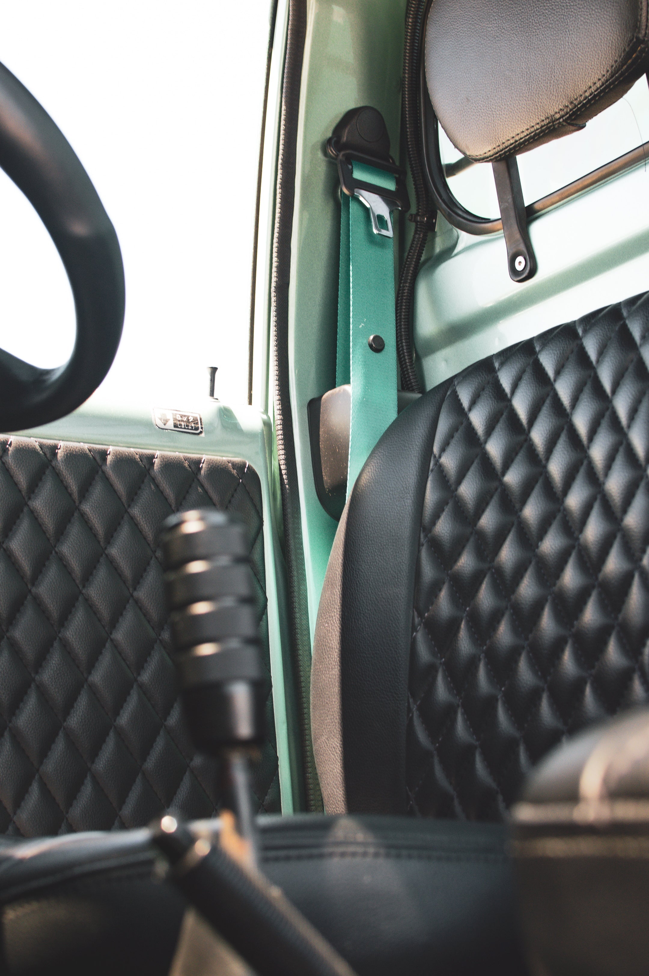 Daihatsu Hijet parts neatly displayed, showcasing essential components for maintenance.