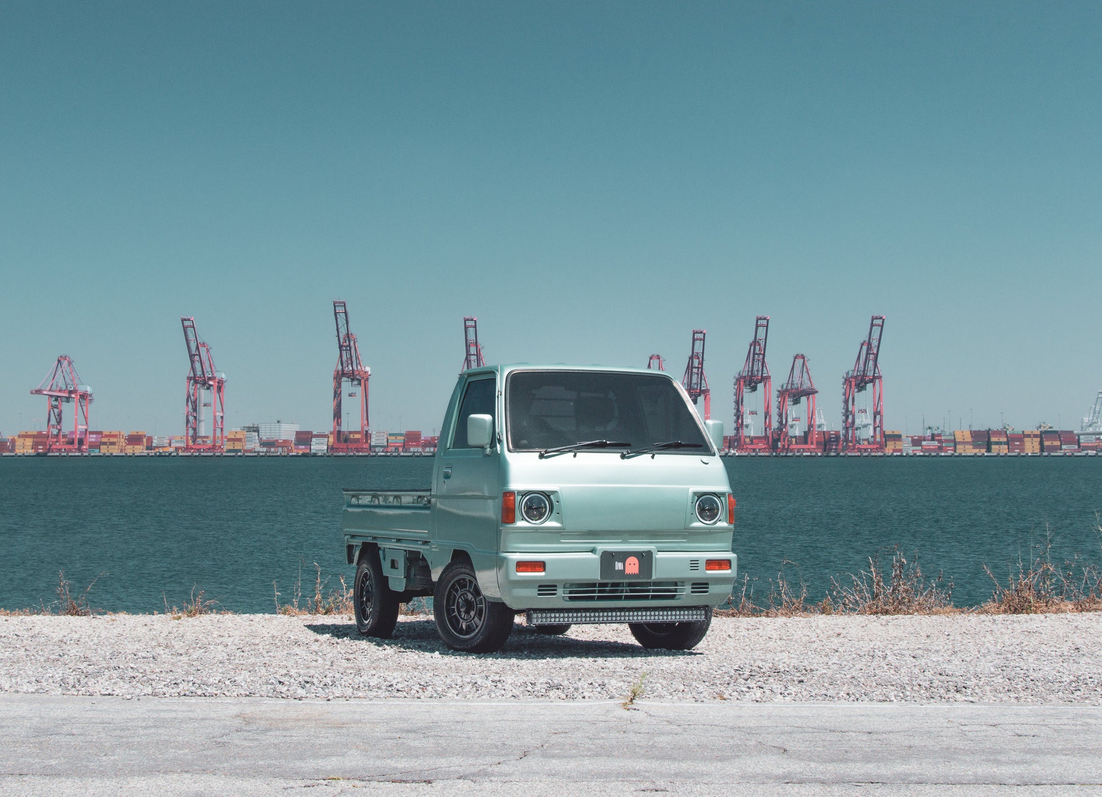 Daihatsu Hijet 4x4 mini truck navigating rugged terrain