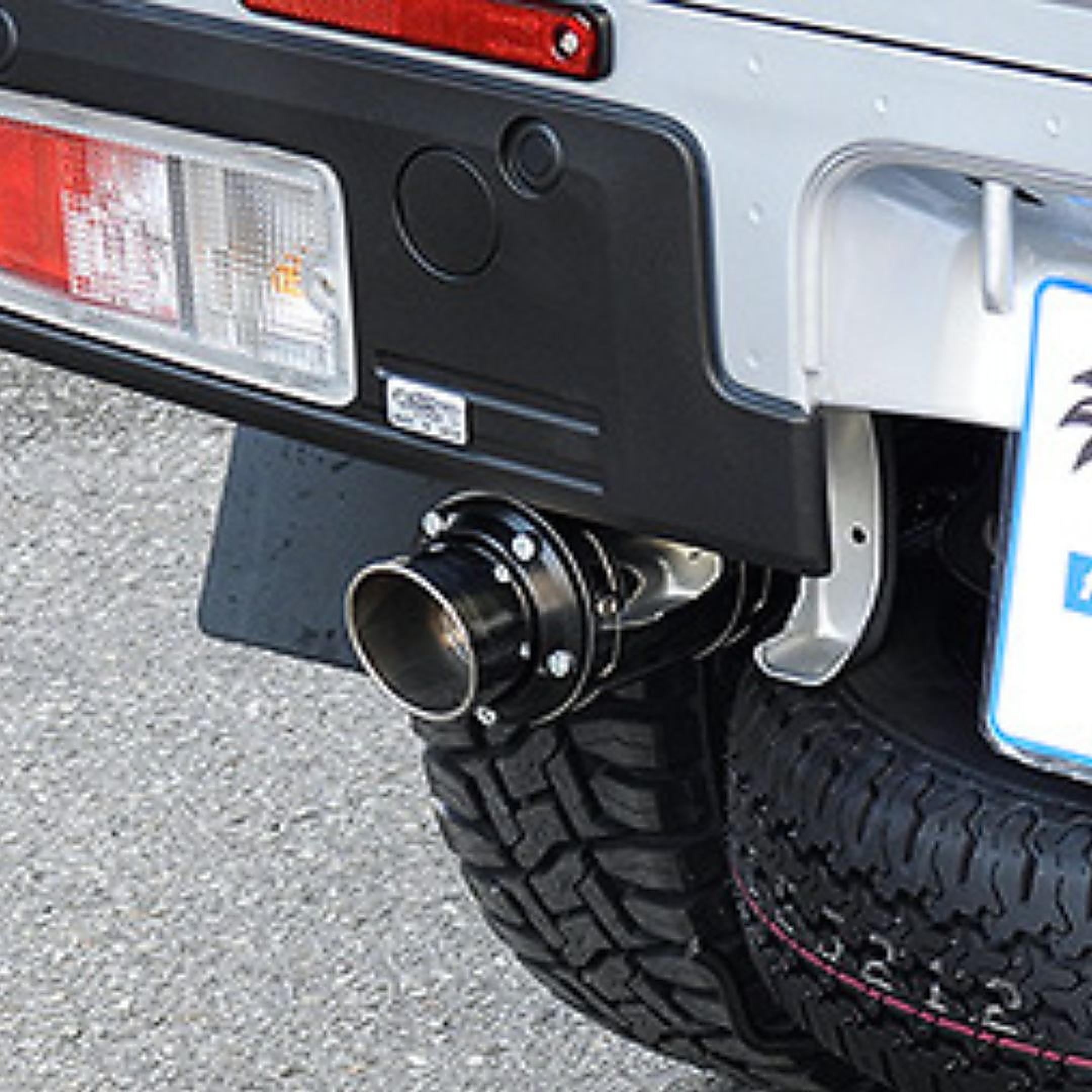 Polished stainless steel exhaust and muffler on the rear bumper of a 2014-Present Daihatsu Hijet S500P/S510P truck
