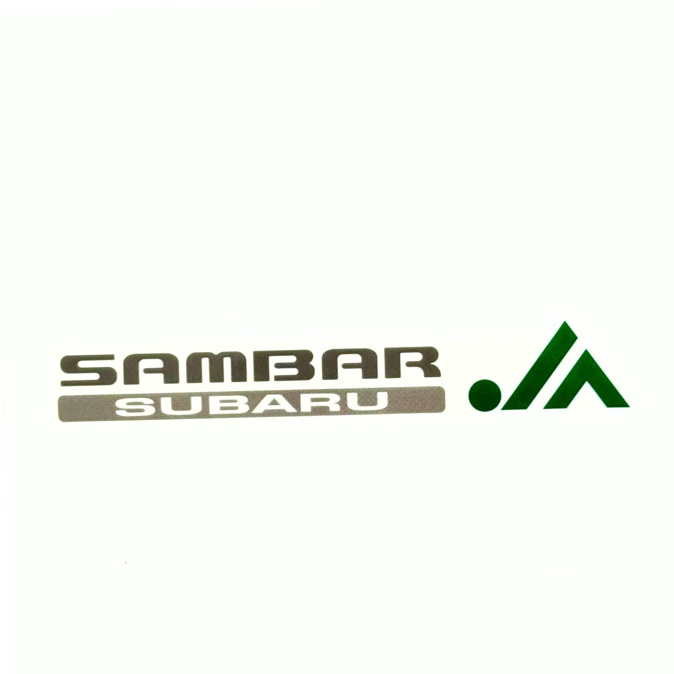 Subaru Sambar decal for TT1 TT2 models (1999-2012) featuring OEM-style silver “Sambar Subaru” logo with green JA emblem.