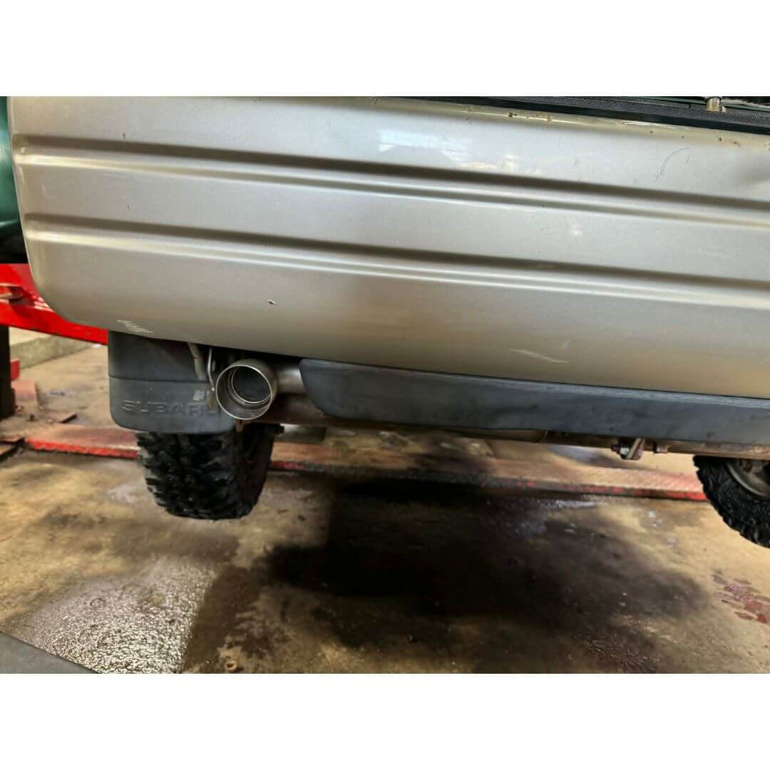 Oiwa Growler Exhaust for Subaru Sambar Van KV3, KV4 (1990-1998) featuring a sleek, behind-the-bumper design.