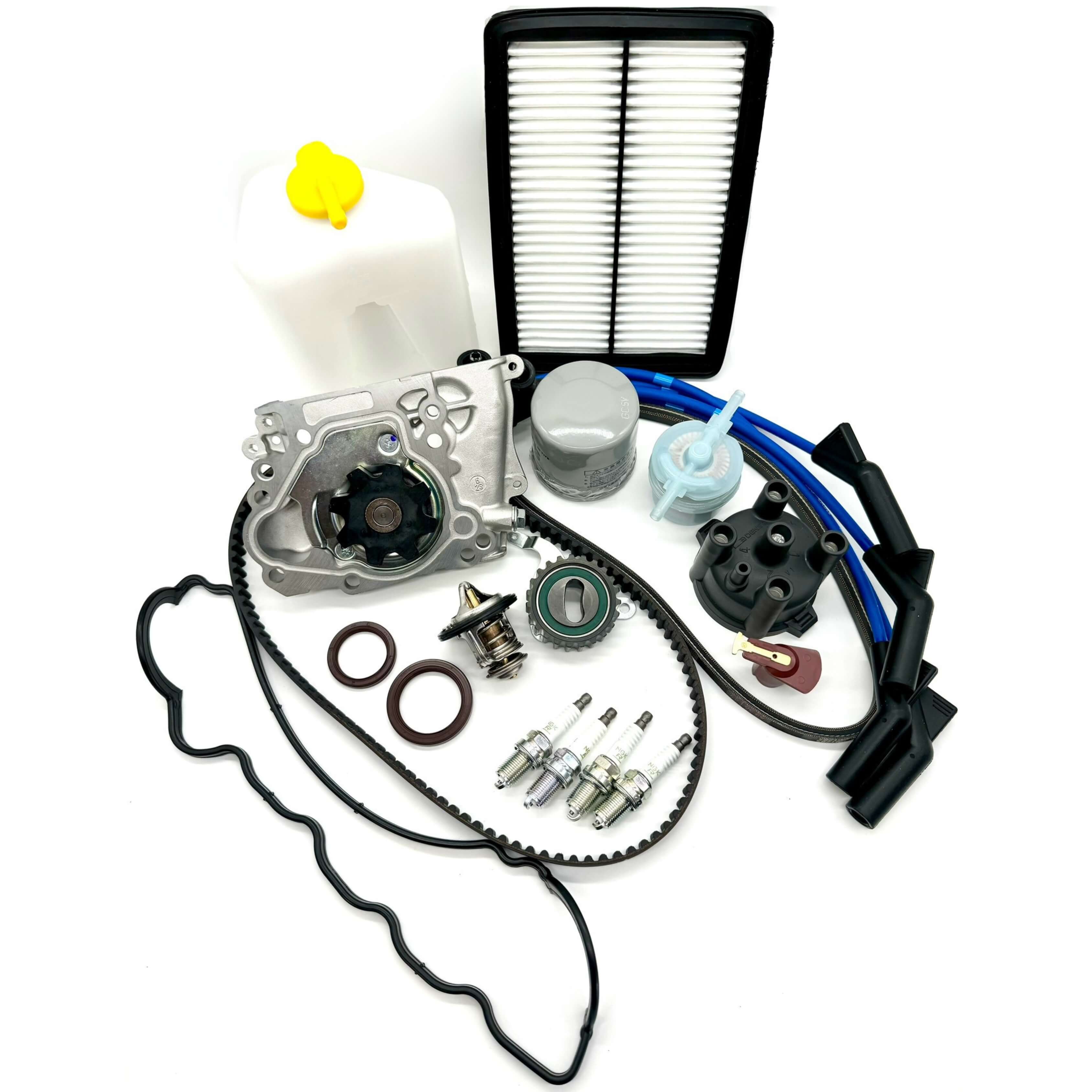 Subaru Sambar KV3 KV4 1990-1998 extensive 22-piece timing belt kit with timing belt, tensioner pulley, cam and crank seals, water pump, gasket, alternator belt, thermostat, valve cover gasket, oil, fuel, air filters, spark plugs, distributor cap and rotor, spark plug wires, and coolant reserve tank for a full engine service.