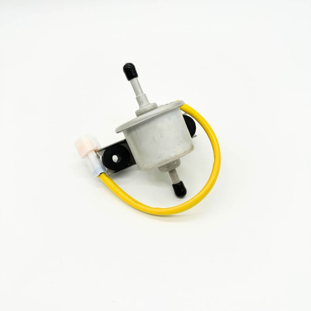 Angled perspective of Subaru Sambar's fuel pump assembly showing metal casing and attached hoses, suitable for models KS3, KS4 from 1990 to 1998.