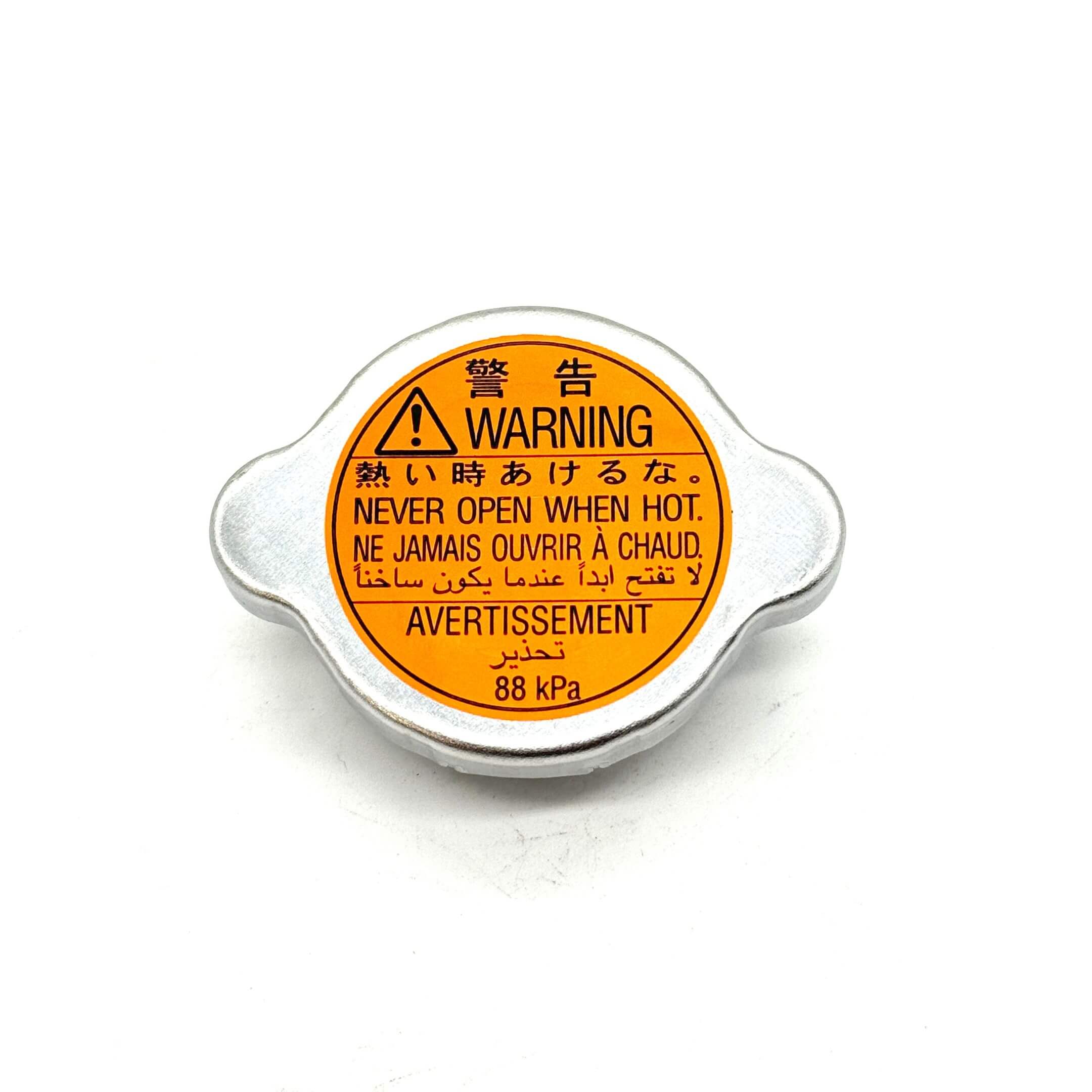 Genuine Subaru radiator cap with 88 kPa pressure rating for Subaru Sambar KV3, KV4 (1990-1998) front view.