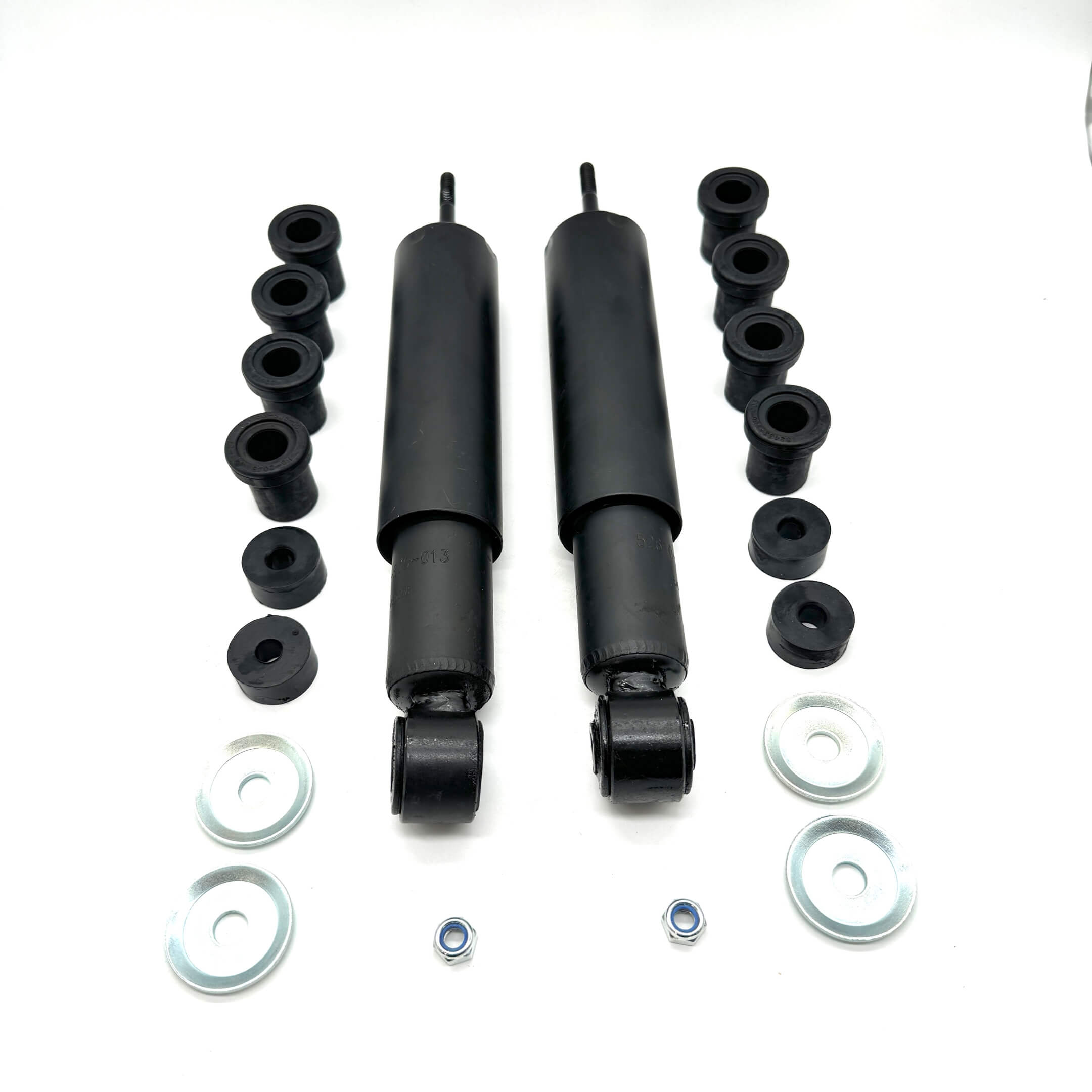 Complete rear suspension kit for Honda Acty Van HH3, HH4 showing bushings, shocks, and hardware isolated on white background.