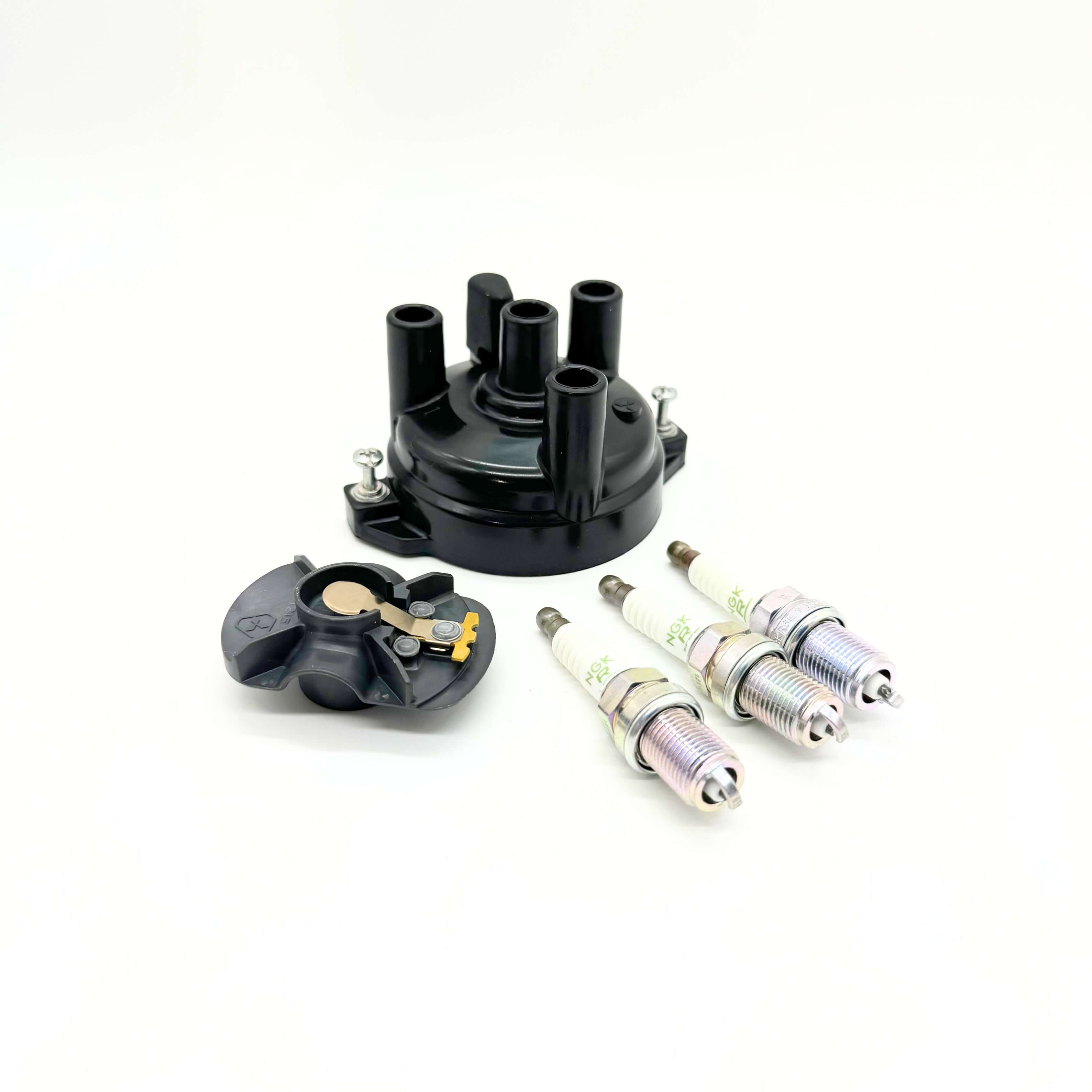 Complete 5-Piece Ignition Kit for Suzuki Carry Truck DC51T, DD51T Models 1991-1998, featuring a high-quality black distributor cap, matching rotor, and three premium spark plugs for efficient combustion and optimal engine performance.