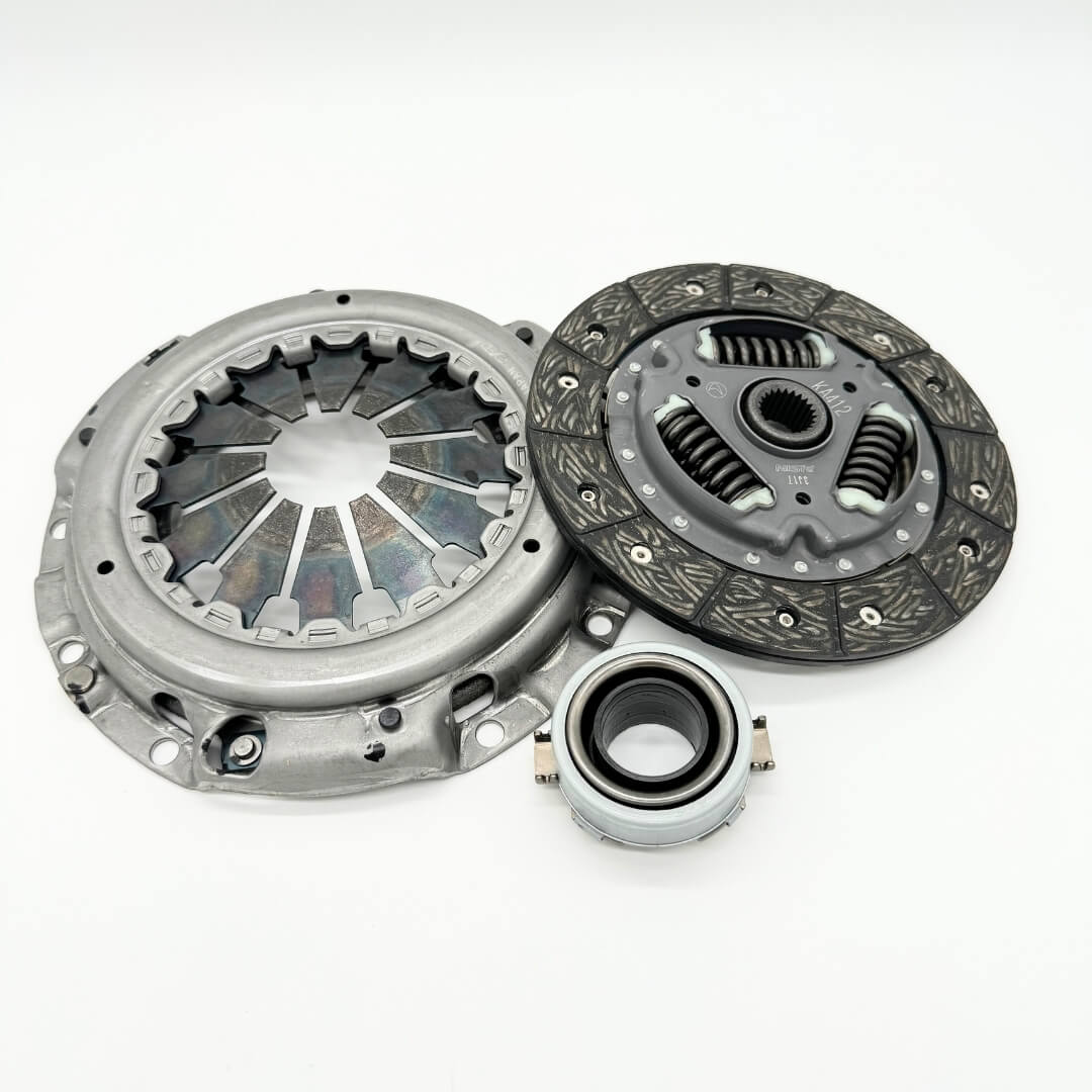 Complete 3-piece clutch replacement kit for Subaru Sambar KV3, KV4 models from 1990-1998, featuring clutch disc, pressure plate, and release bearing, ready to install from Oiwa Garage.