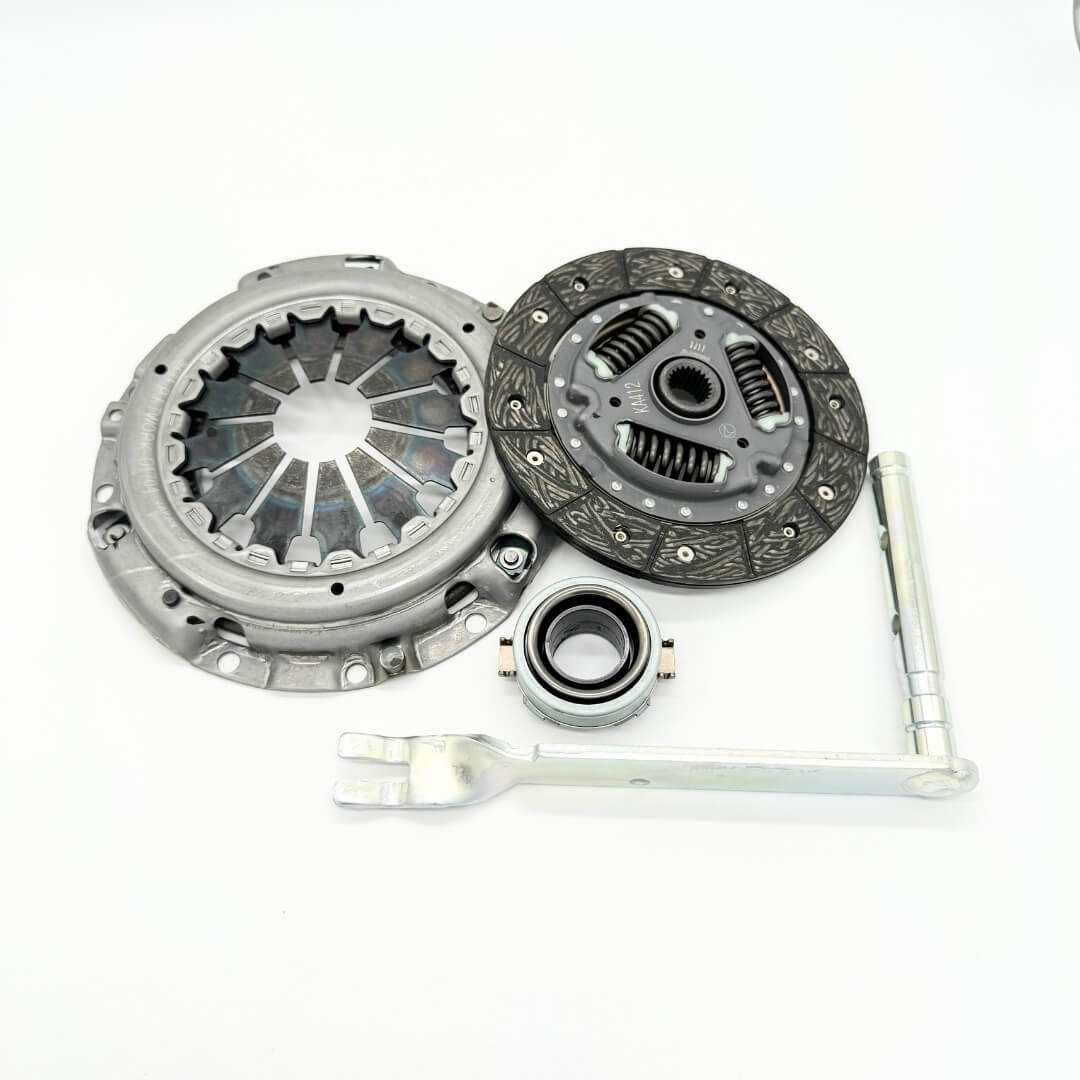 Comprehensive 4-piece clutch replacement kit for 1990-1998 Subaru Sambar KV3, KV4 models, including clutch disc, pressure plate, release bearing, and release lever, available at Oiwa Garage.