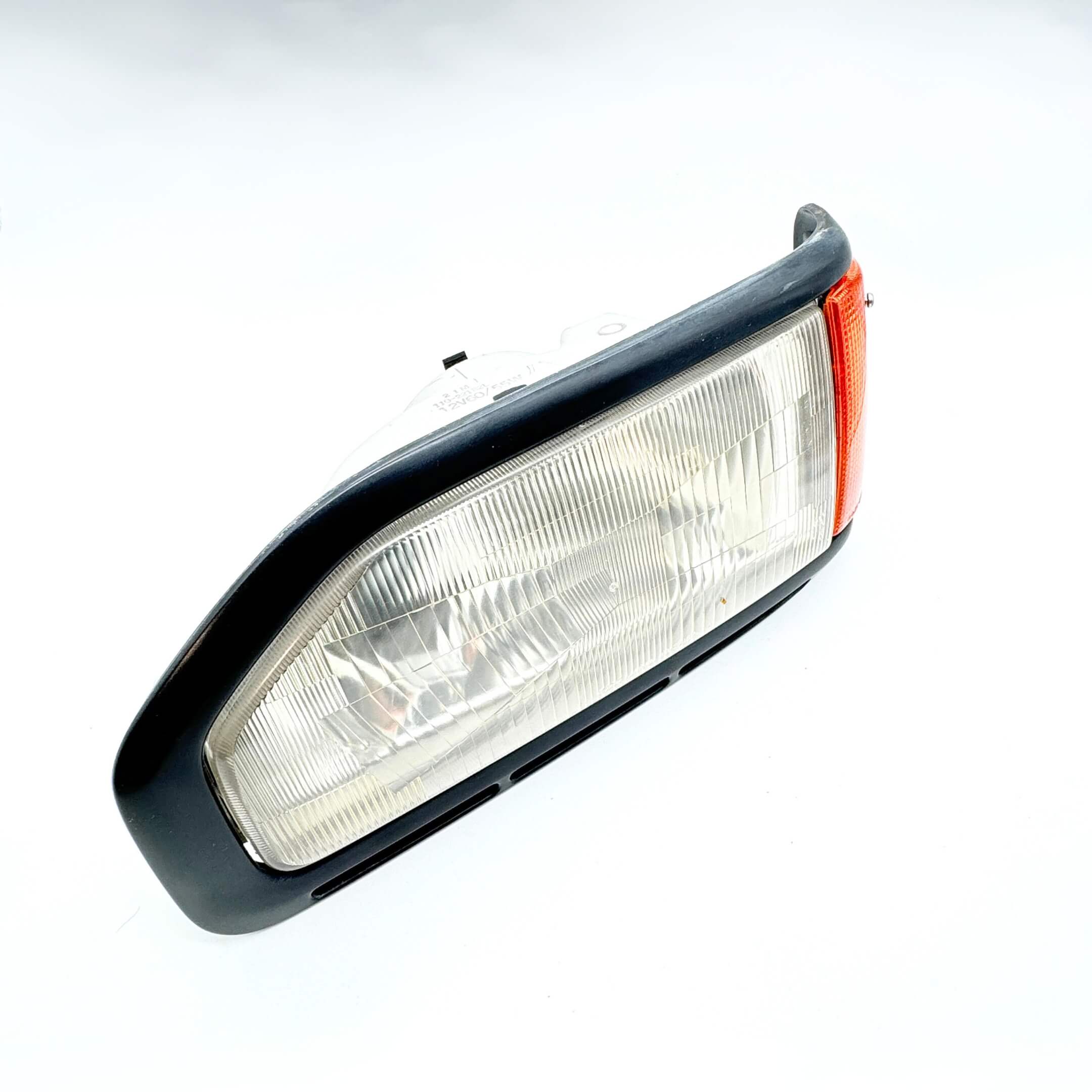 Top view of Left Headlight Assembly for Honda Acty Van HH3, HH4 models (1990-1993) highlighting the sleek design