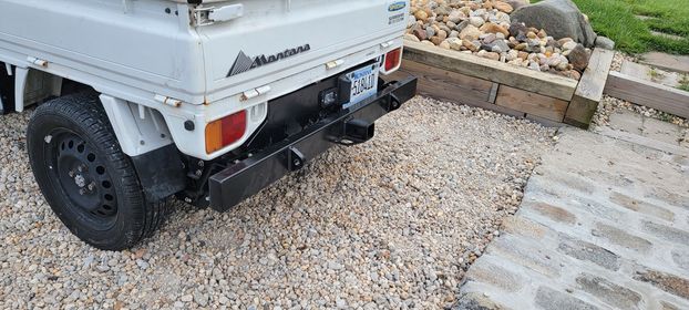 Subaru Sambar KV3, KV4 with black rear tow bumper and engine cover installed, showing license plate relocation and robust construction, 1990-1998 models