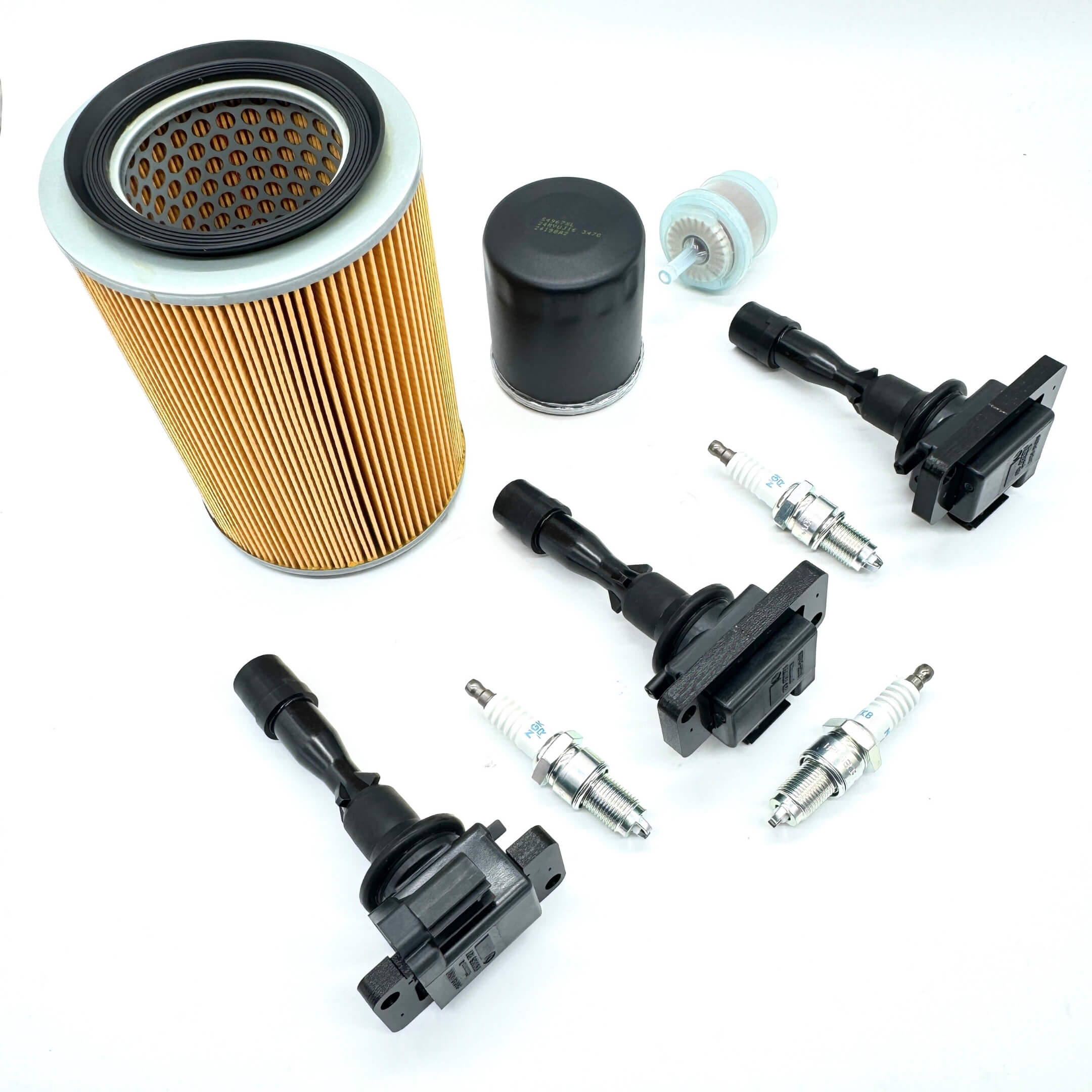 Complete 9-Piece Tune-Up Kit for Daihatsu Hijet S100P, S110P (1994-1998) with EFGS Engines, including air filter, fuel filter, oil filter, ignition coils, and spark plugs.