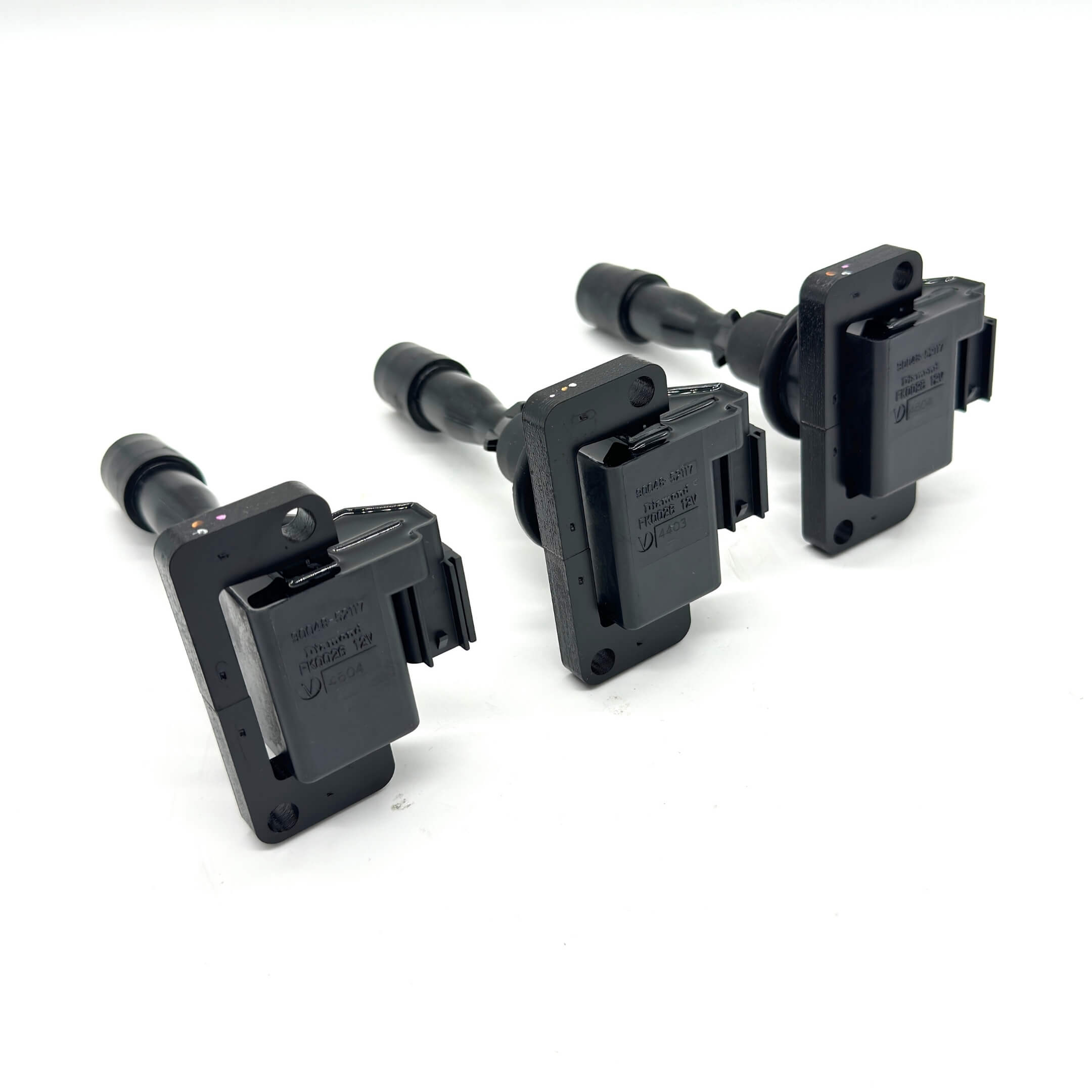 Set of three Genuine Daihatsu ignition coils for EFGS engines, built to enhance reliability and performance for Daihatsu Hijet Trucks (1994-1998).