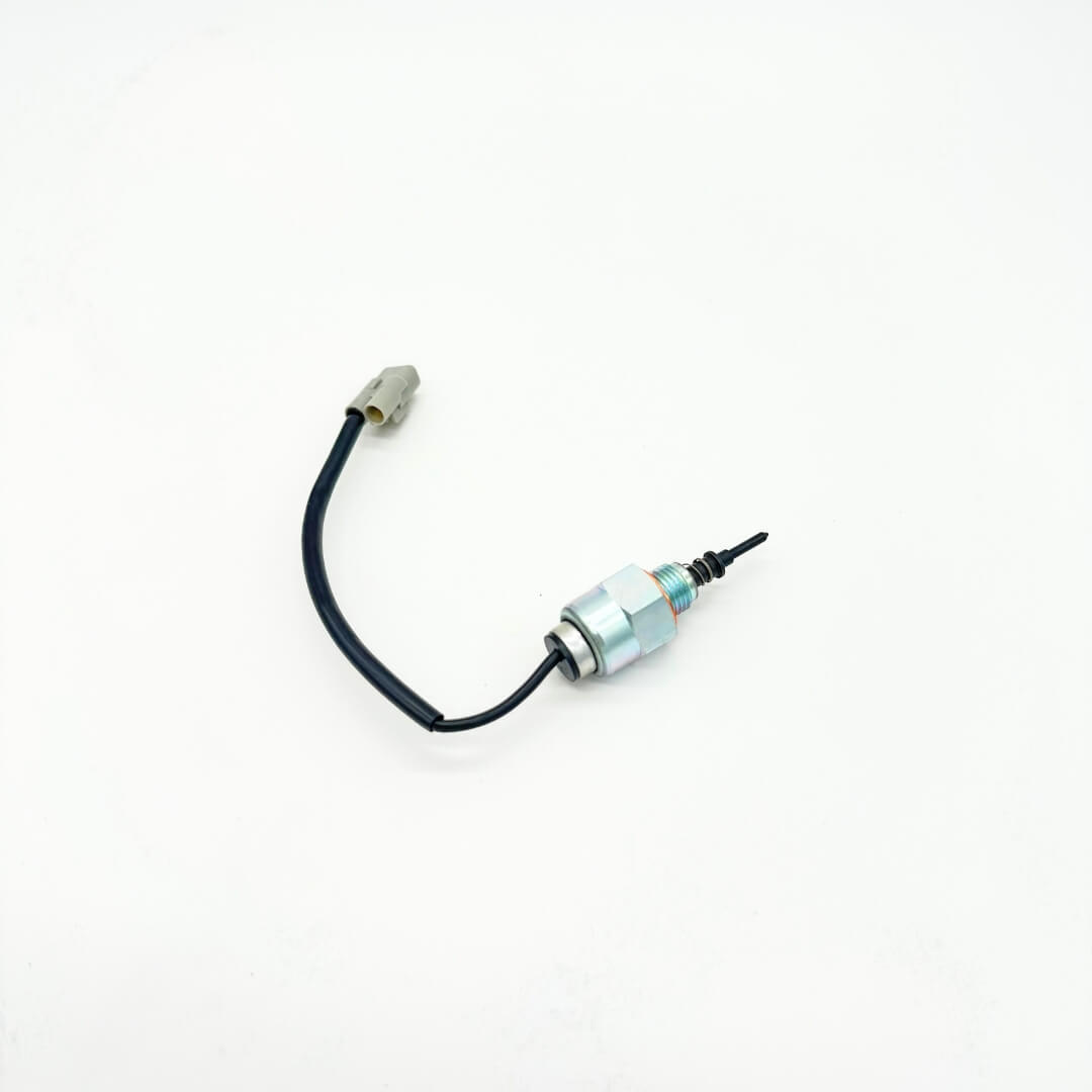 Detailed view of the fuel cutoff solenoid for Subaru Sambar models KV3 and KV4, built for 1990-1998, with mounting bracket and solenoid plunger.