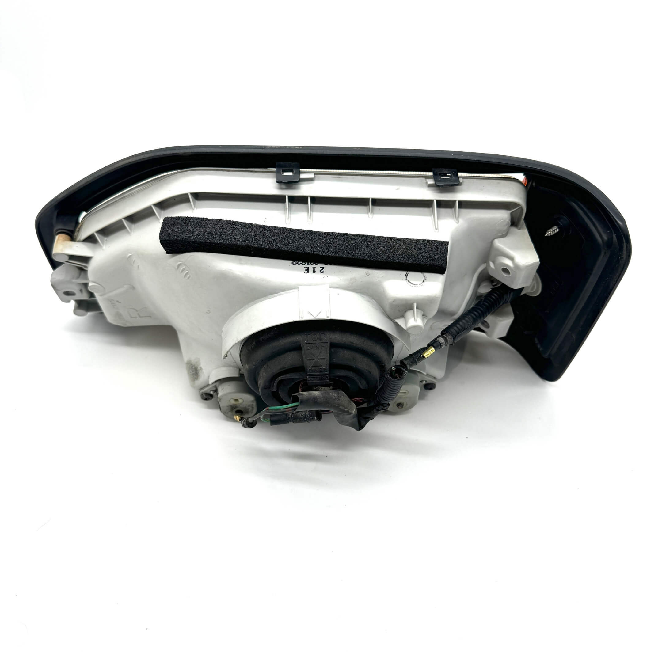 Detailed back view of right headlight assembly for Honda Acty Van HH3, HH4 models 1990-1993, highlighting electrical connections.