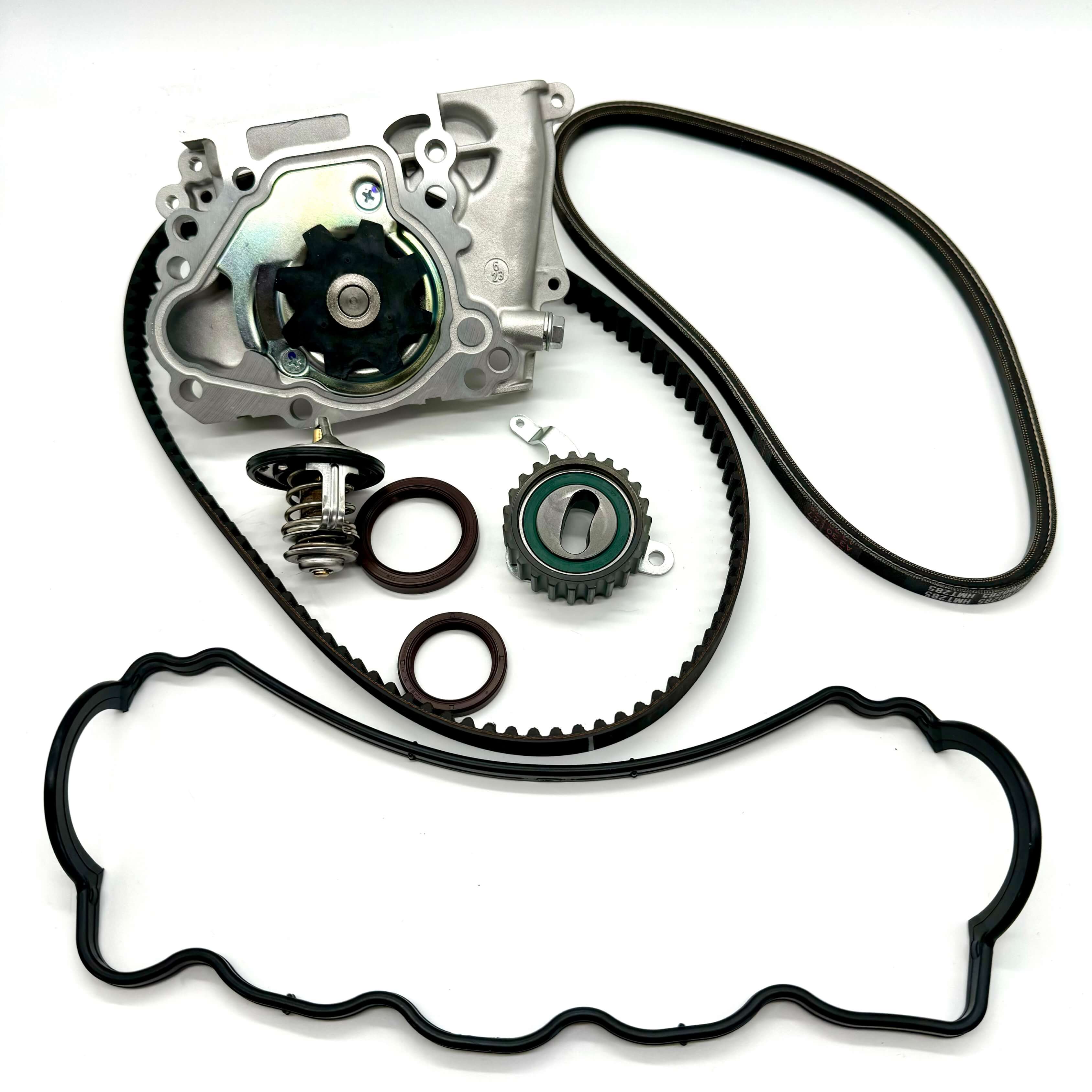 Complete 8-piece timing belt kit for Subaru Sambar KV3 KV4 1990-1998 with timing belt, cam and crank seals, tensioner pulley, water pump, alternator belt, thermostat, and valve cover gasket for full engine maintenance.