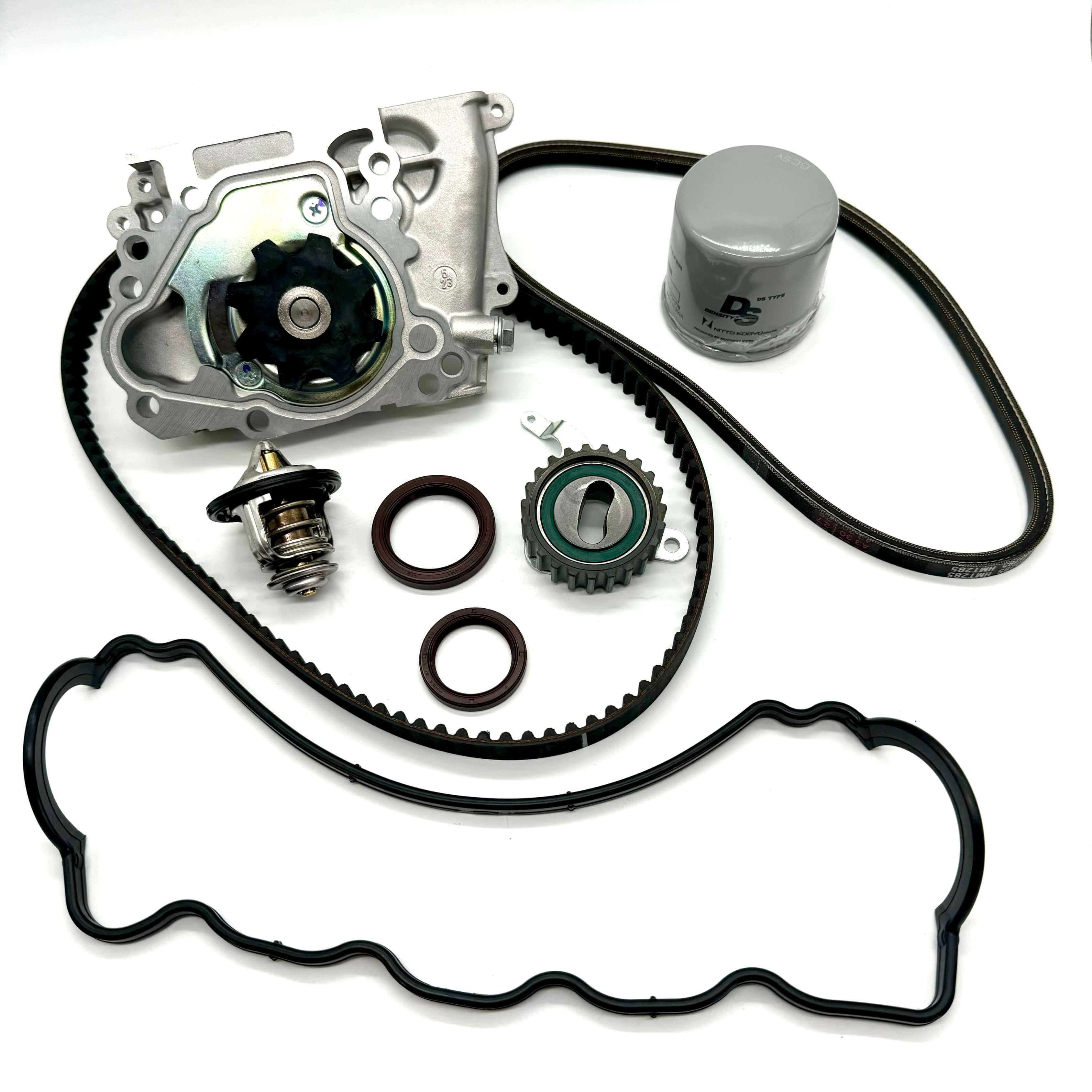 Complete 9-piece timing belt kit for Subaru Sambar KV3 KV4 1990-1998, featuring timing belt, tensioner pulley, cam and crank seals, water pump with gasket, alternator belt, thermostat, valve cover gasket, and oil filter for optimal engine maintenance