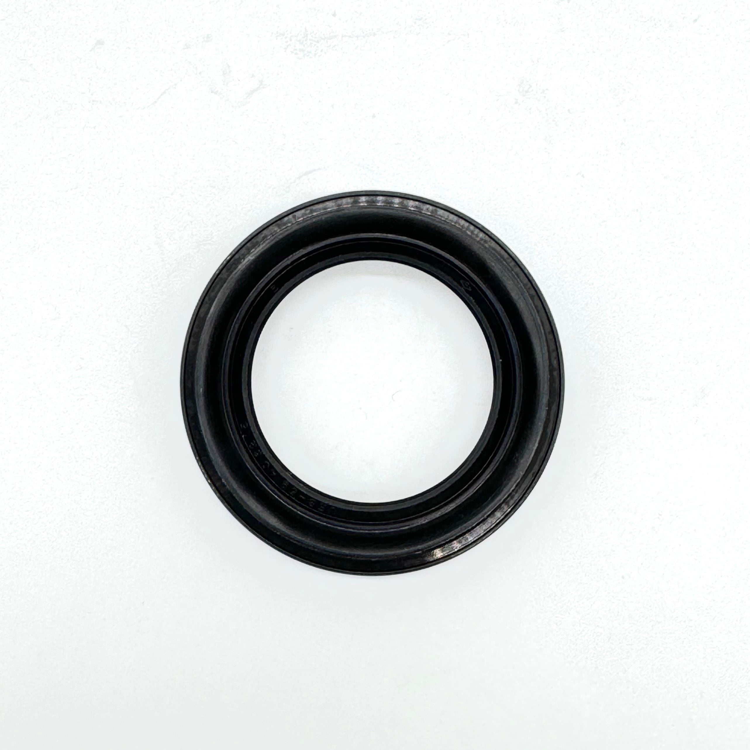 Close-up of the rear right outer wheel seal for 1990-1999 Honda Acty HH3, HH4, crucial for wheel bearing protection.