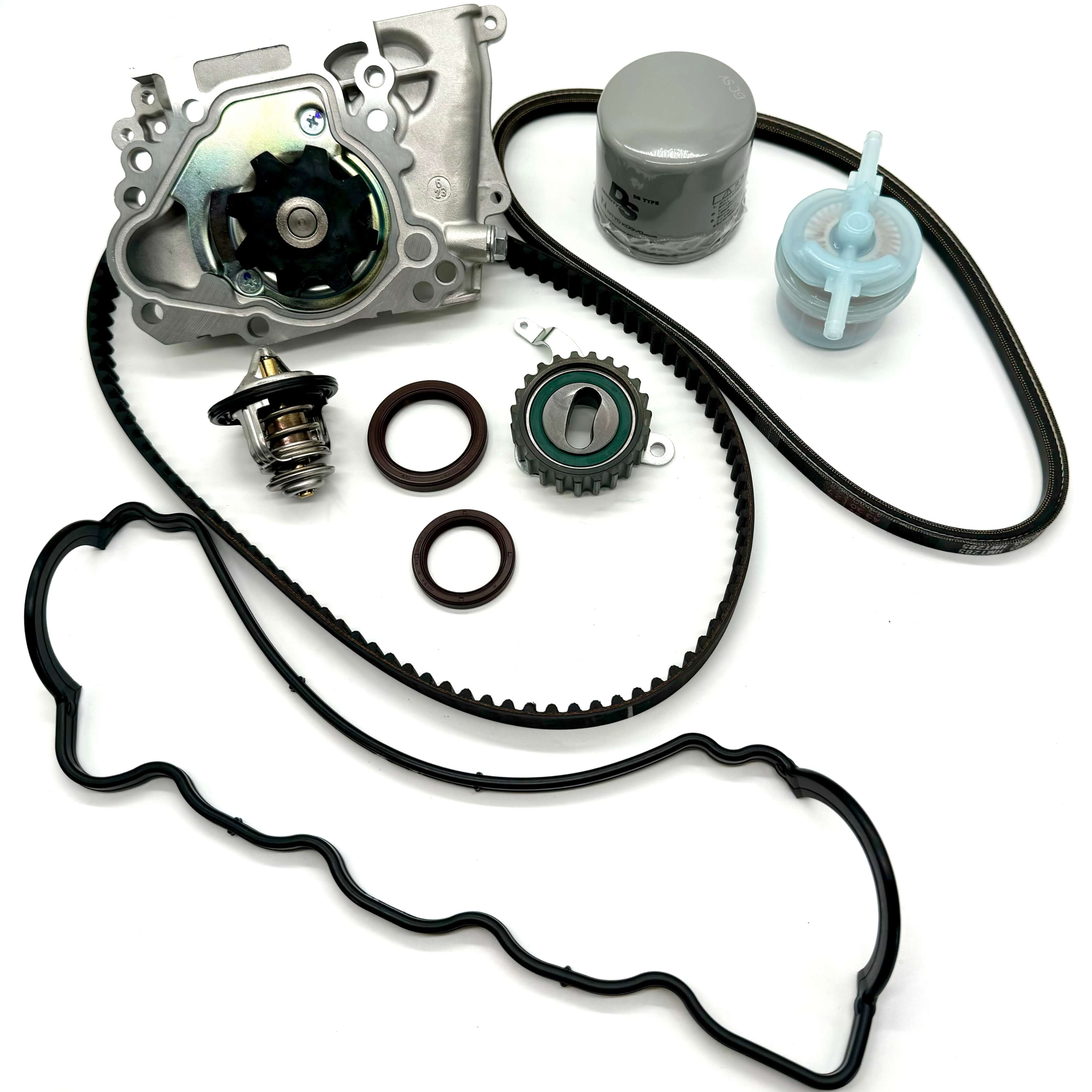 Subaru Sambar KV3 KV4 1990-1998 complete 10-piece timing belt kit with timing belt, tensioner pulley, cam and crank seals, water pump, alternator belt, thermostat, valve cover gasket, oil and fuel filters for full engine service.