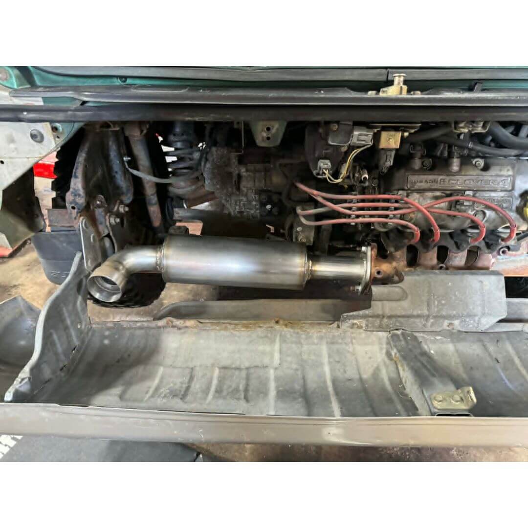 Oiwa Growler Exhaust for Subaru Sambar Truck TT1, TT2 Models (1999-2012) featuring a sleek, behind-the-bumper design.