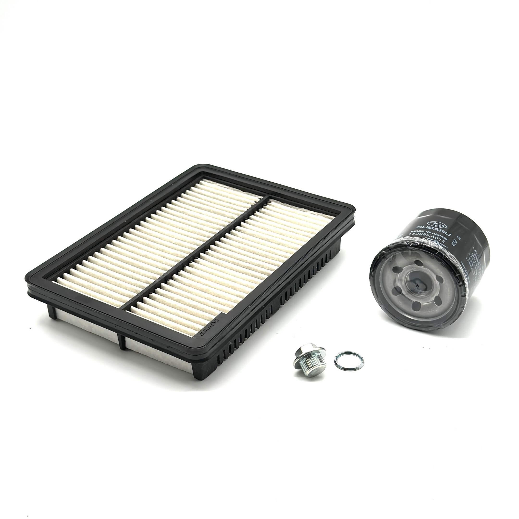 Genuine Subaru Sambar Truck TT1, TT2 air filter, oil filter, and drain plug set for 1999-2012 models, featuring a black and white air filter and a black oil filter.