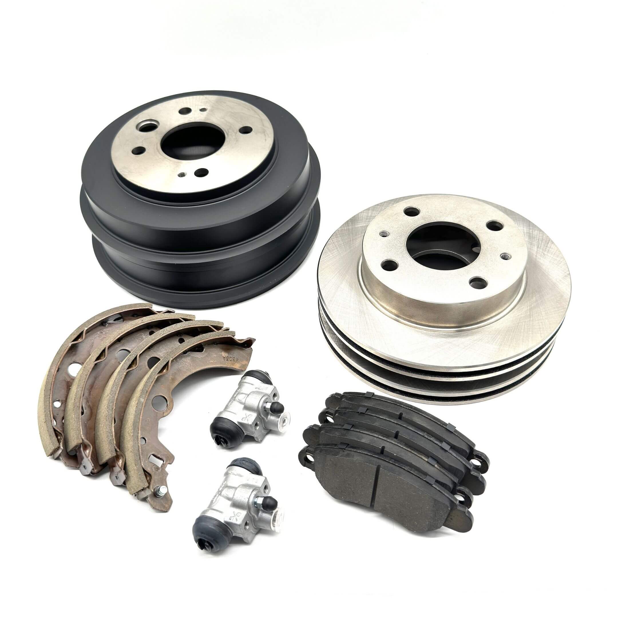 Complete Subaru Sambar brake kit components laid out for full front and rear service.