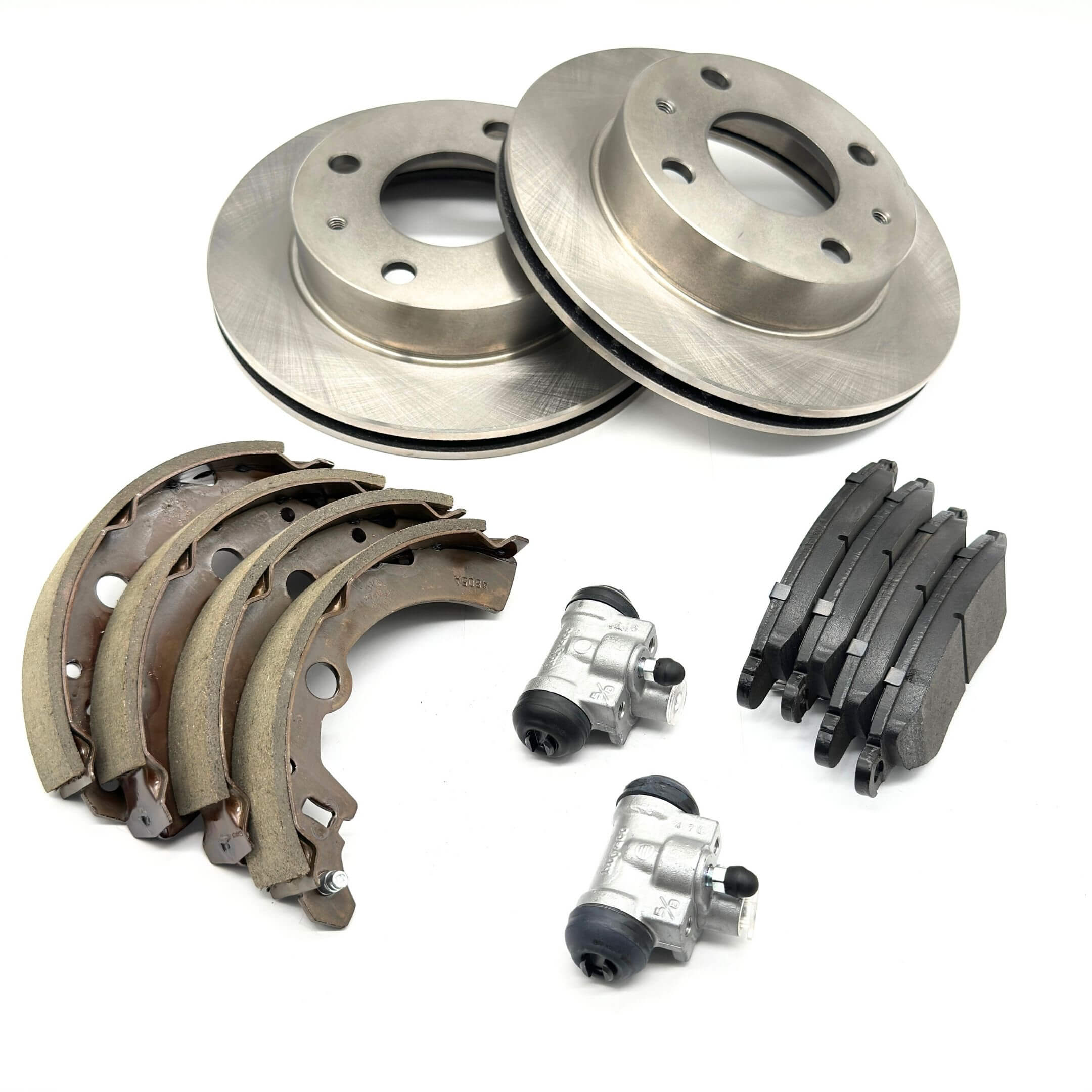 Brake Kit - 12 Piece featuring silver front brake rotors, rear brake drum wheel cylinders, black front brake pads, and brown rear brake shoes for Subaru Sambar Wagon TW1, TW2 Models 1999-2012.