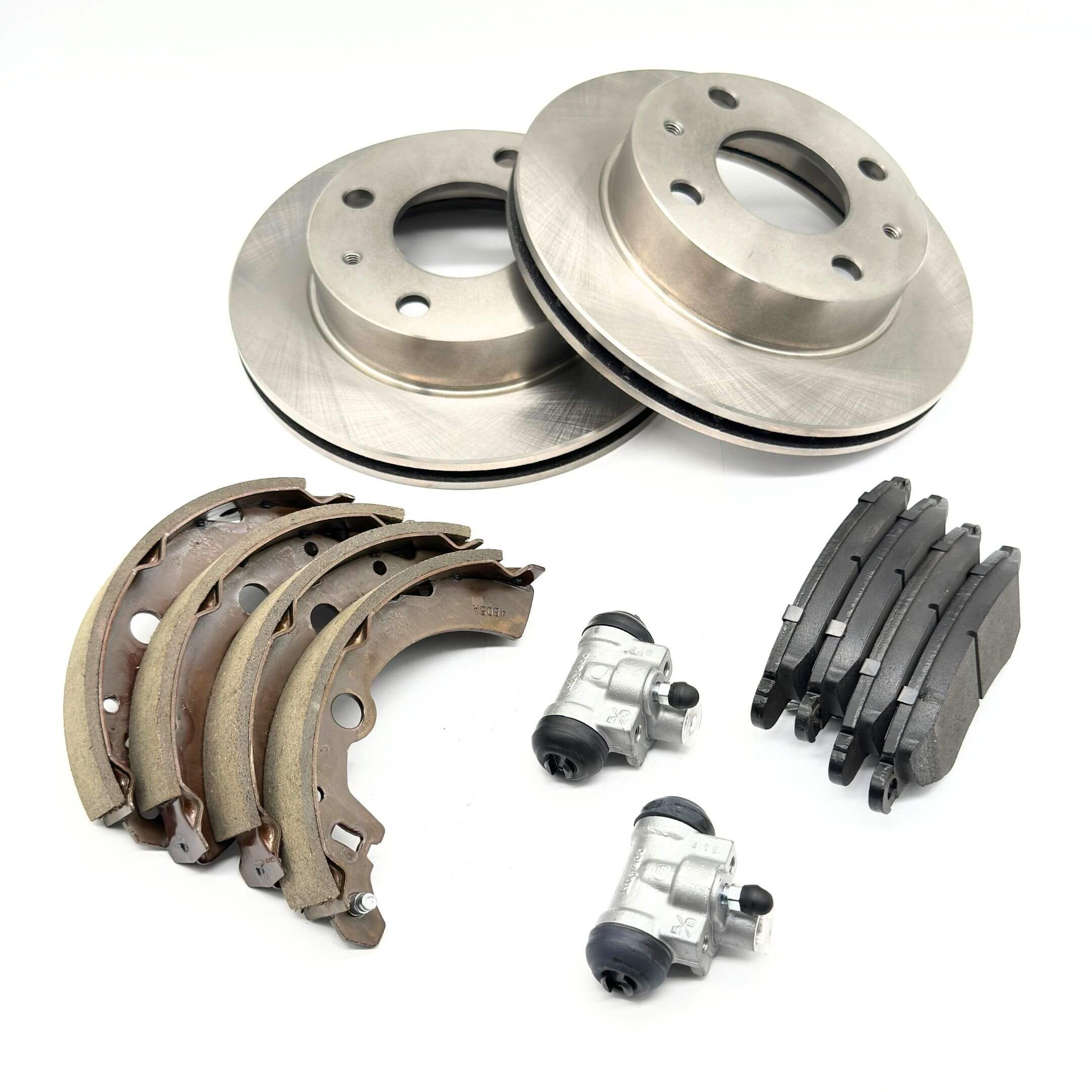 Brake Kit - 12 Piece for Subaru Sambar Truck TT1, TT2 (1999-2012) featuring front brake rotors, rear brake drum wheel cylinder, front brake pads, and rear brake shoes in metallic and black tones.
