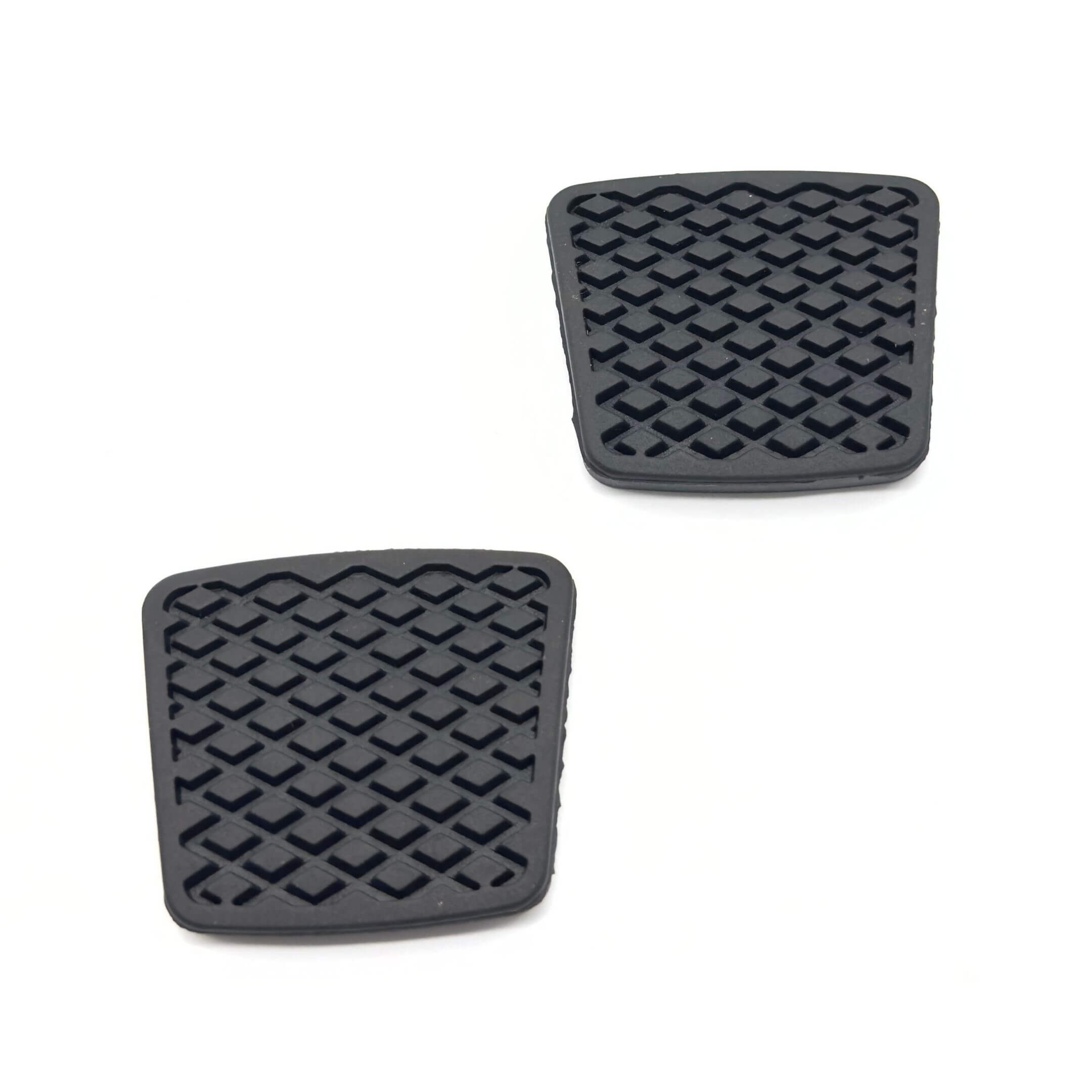Black clutch and accelerator pads for Subaru Sambar Truck TT1, TT2 models (1999-2012) featuring a textured surface for enhanced grip.