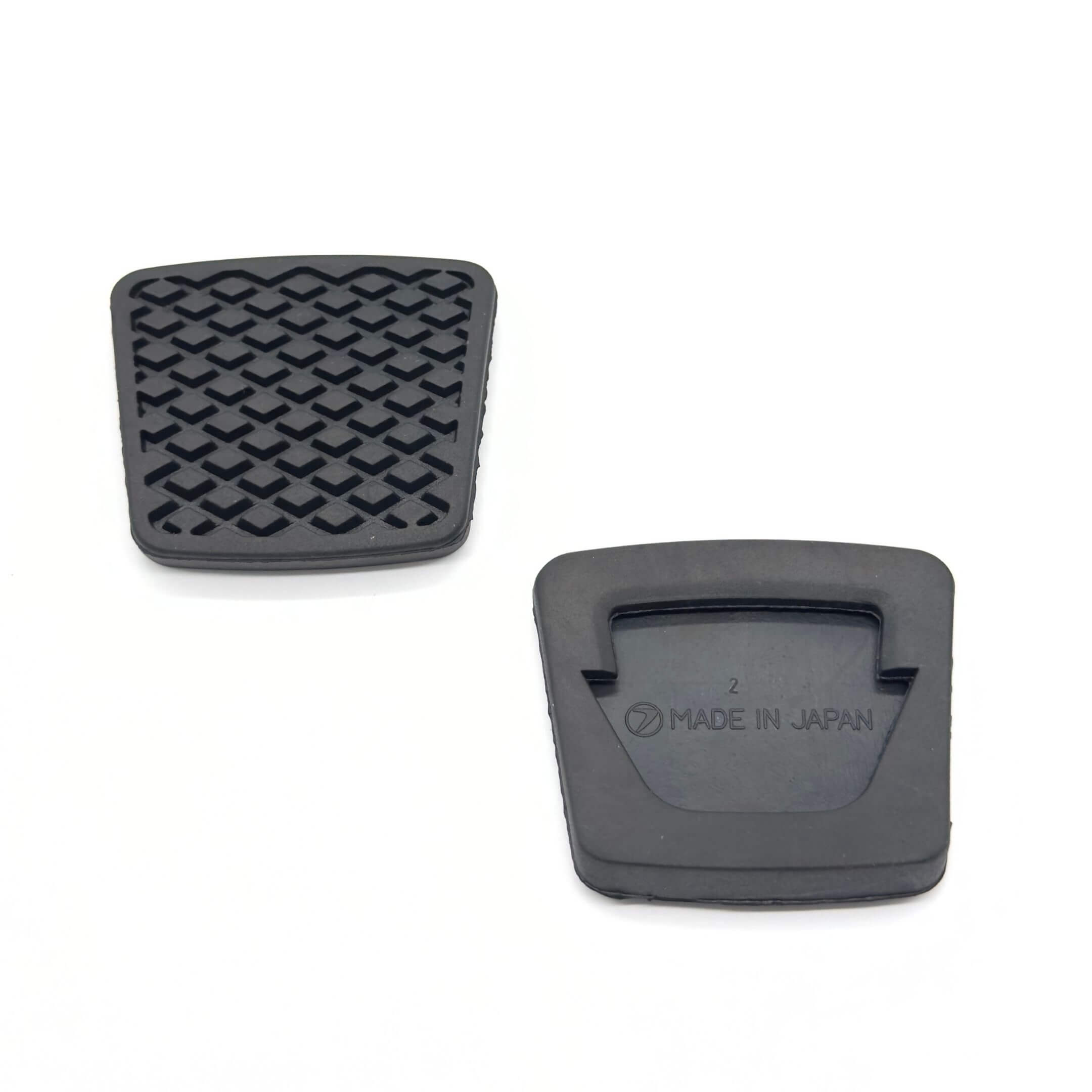Genuine black clutch and accelerator pads for Subaru Sambar Truck TT1, TT2 models (1999-2012), featuring a textured surface and "Made in Japan" marking.