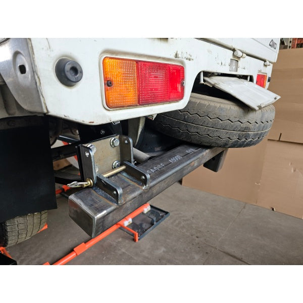 Suzuki Carry DD51T Rear Baird Bumper, 1991-1999 model, featuring a robust metal design with mounting brackets.