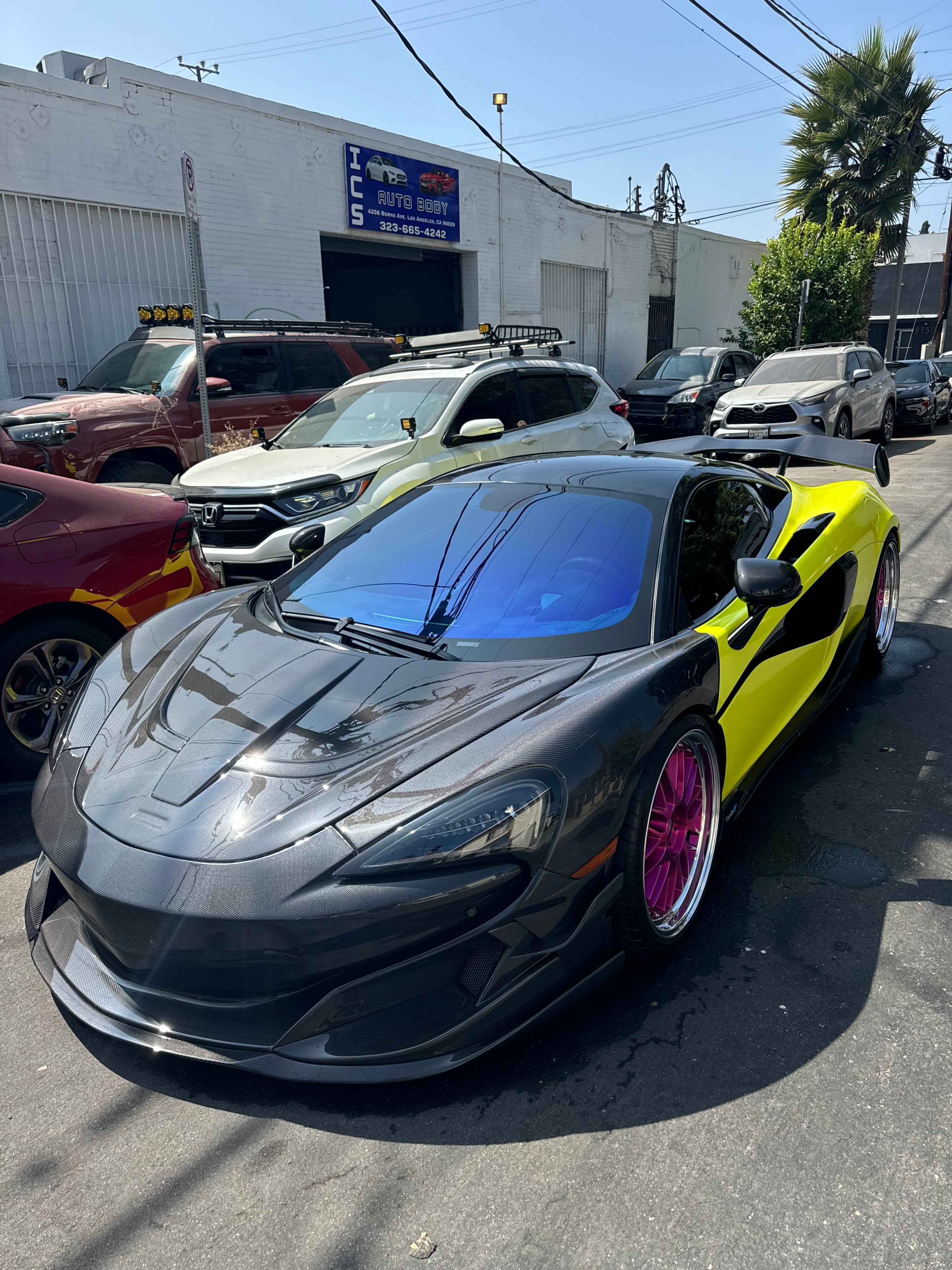 McLaren sports car with Omnique Zircon Tint, combining a futuristic look with subtle blue tint.