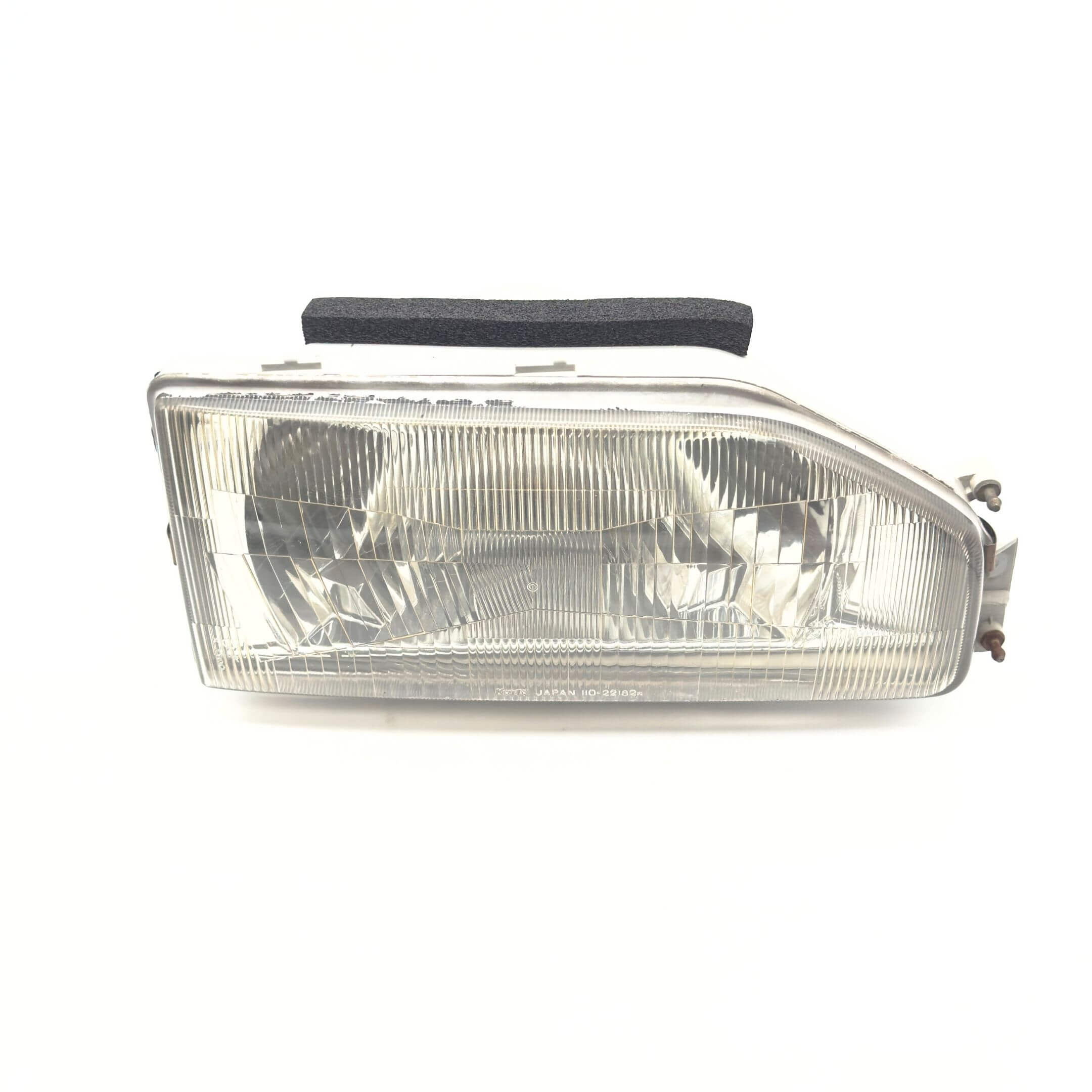 Headlight - Right / Driver Side for Honda Acty Van Models HH3, HH4 (1990-1993) featuring a clear lens and durable construction.