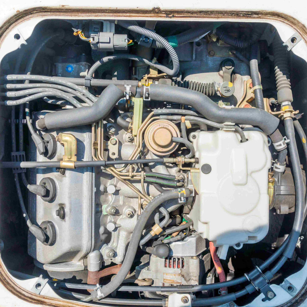 Honda Acty Engine Parts Collection for HA3, HA4 Models (1990-1999), Including Spark Plug Wires, Alternator, Hoses, and Essential Components for Maintenance and Restoration.