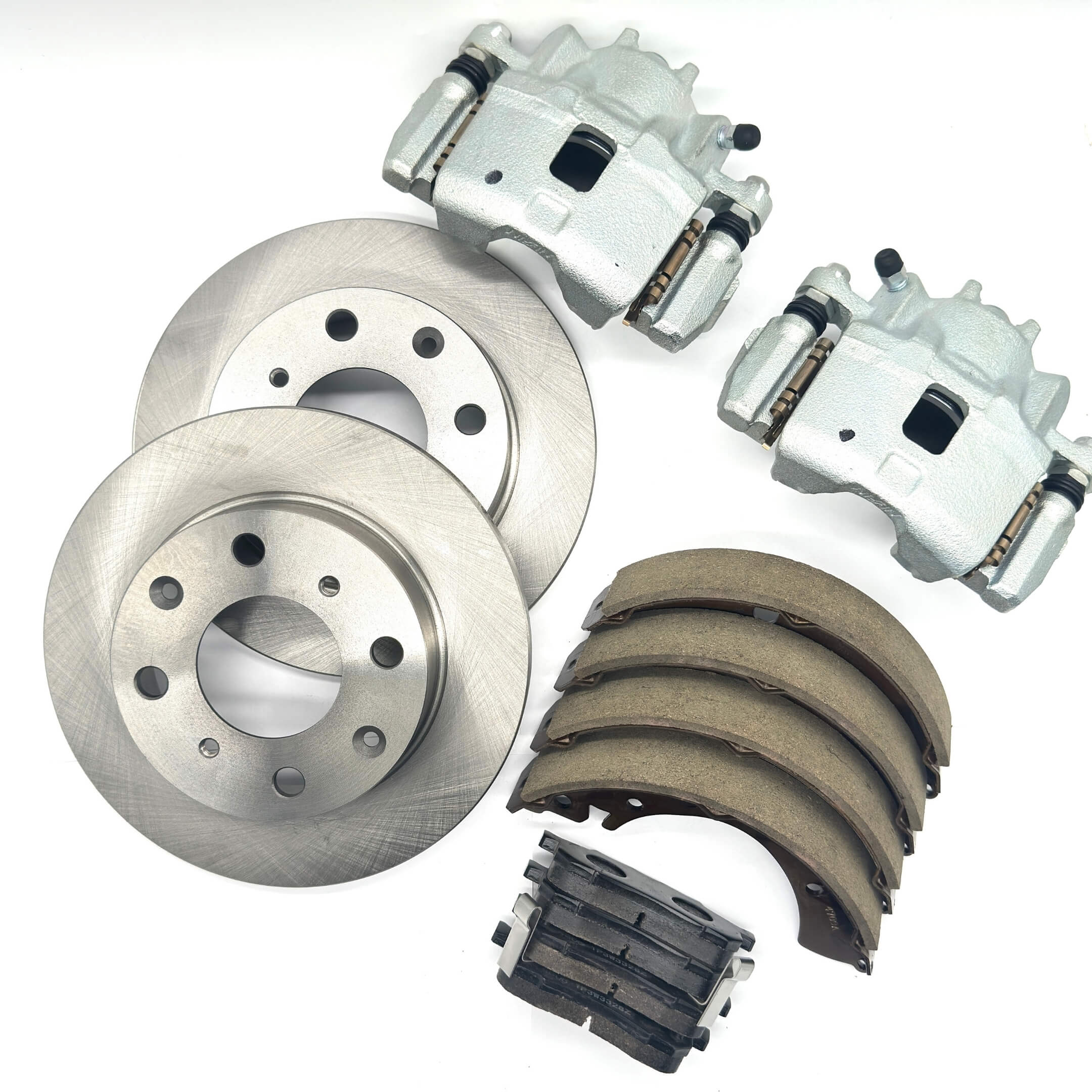 Brake Package - 4 Piece set featuring silver front brake rotors, calipers, front brake pads, and rear brake shoe set for Honda Acty Truck HA8, HA9  models 2009-2022.