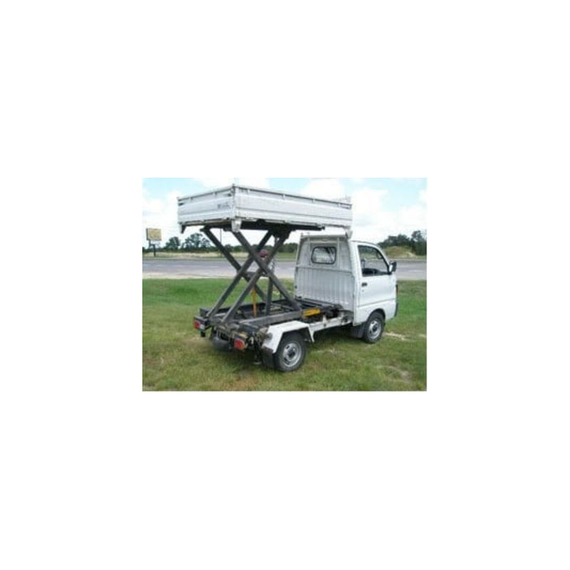 White Japanese mini kei truck equipped with a hydraulic scissor-lift cargo bed—optimized for increased ground clearance, visibility, safety, load capacity, comfort, and performance.