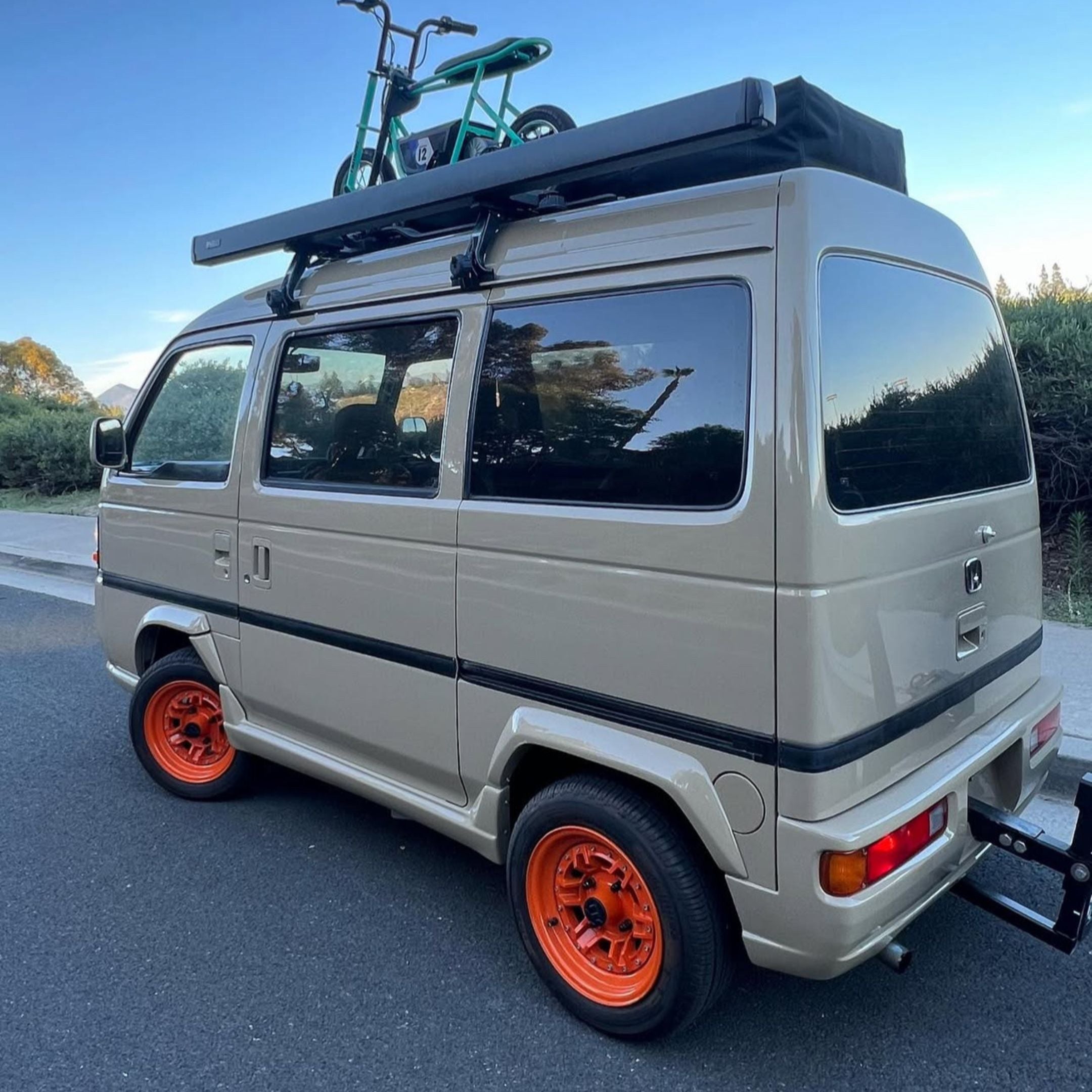 Rear three‑quarter view of Tan Honda Acty Van with Mag Factory Impact‑Resistant Fender Flares, highlighting the bolt‑on installation, seamless OEM‑style integration, and enhanced wheel coverage for an aggressive stance.