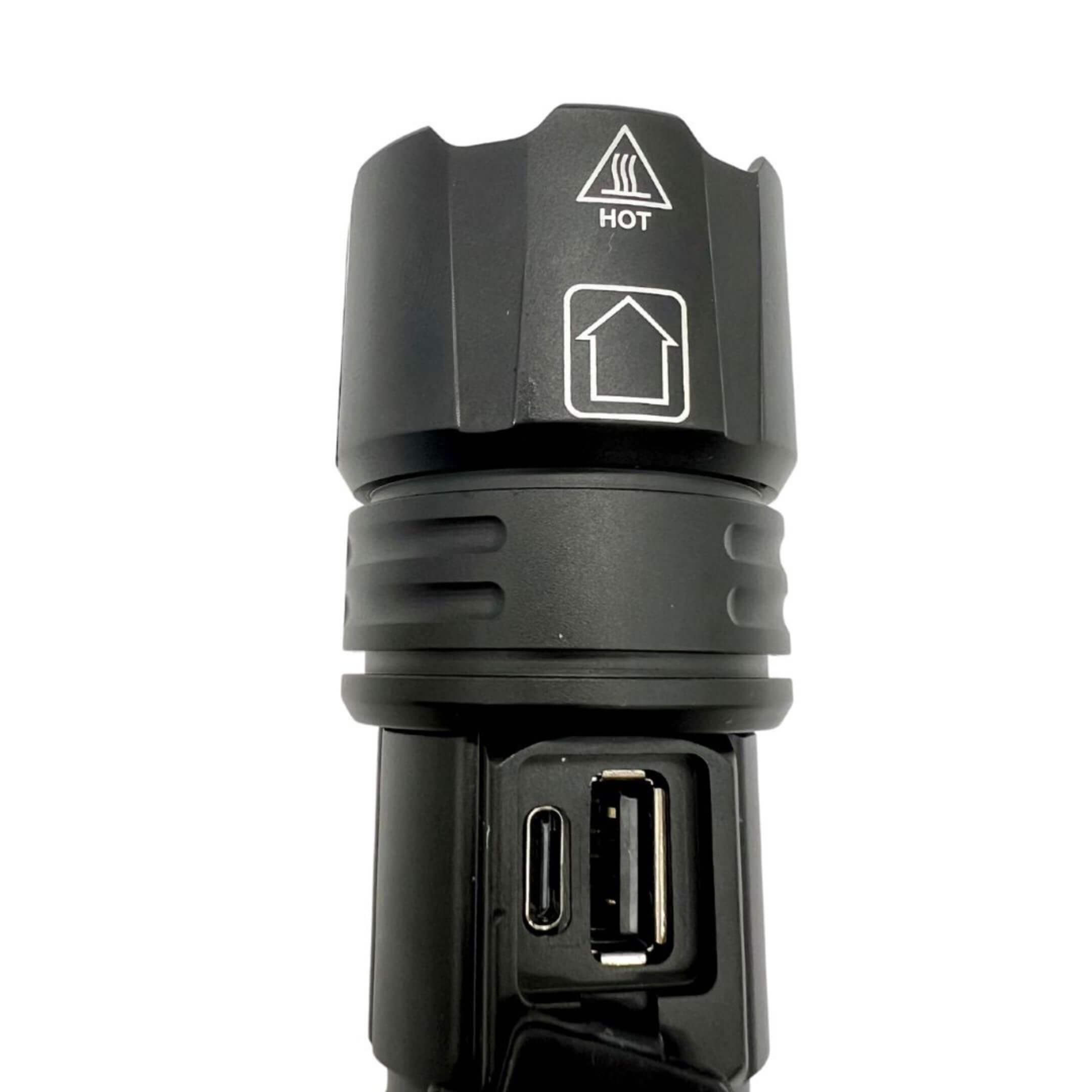 Close‑up of Oiwa UltraBeam 300W USB LED Flashlight showing integrated USB‑C charging port and USB‑A power‑output for device charging.