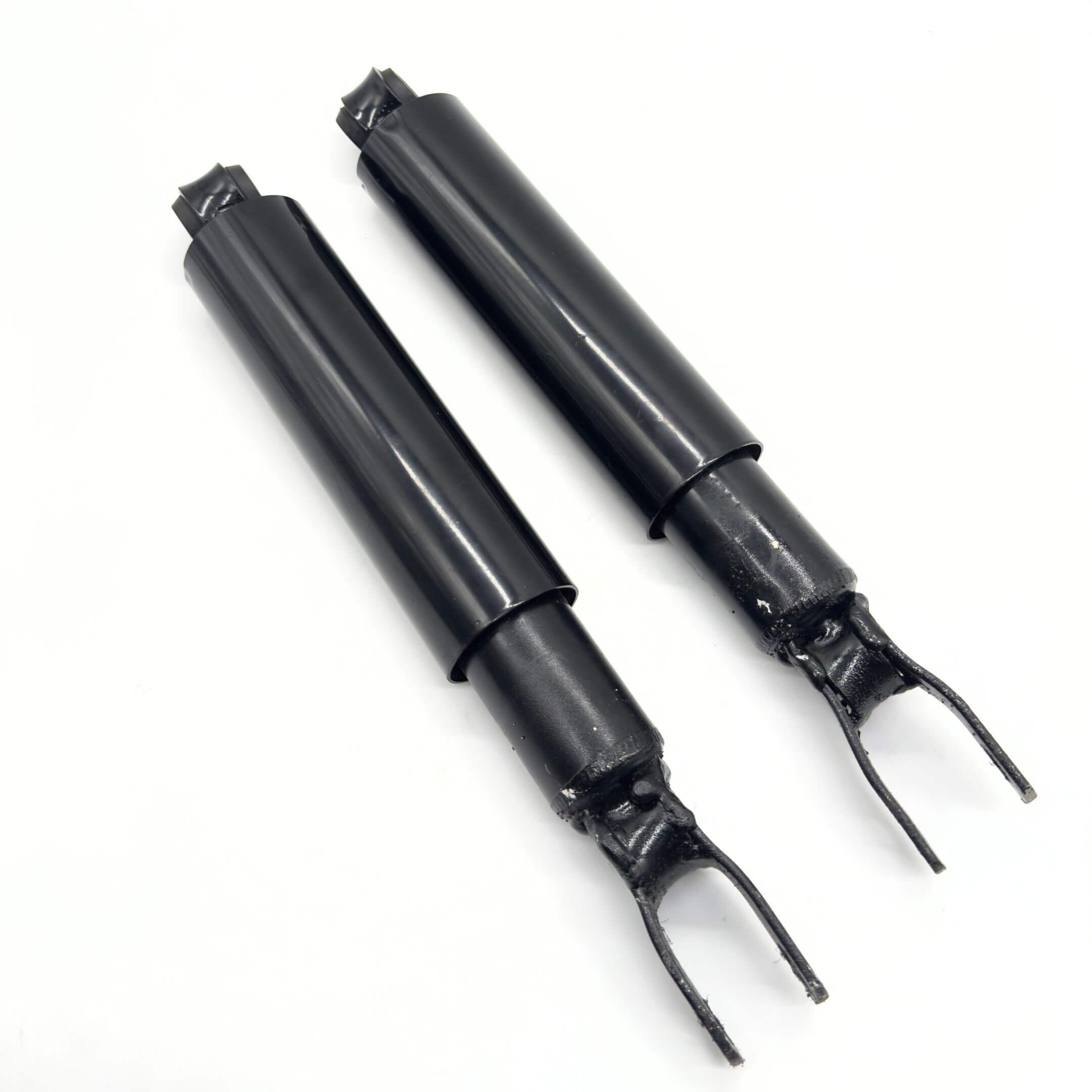 Black rear shocks for Subaru Sambar Truck TT1, TT2 models, 1999-2012, featuring durable construction and precise fit.