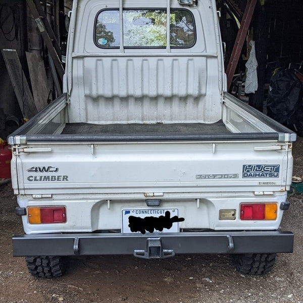 Daihatsu Hijet S110P rear bumper with tow bar, designed for 1994-1998 models, shown in white with 4WD Climber branding.