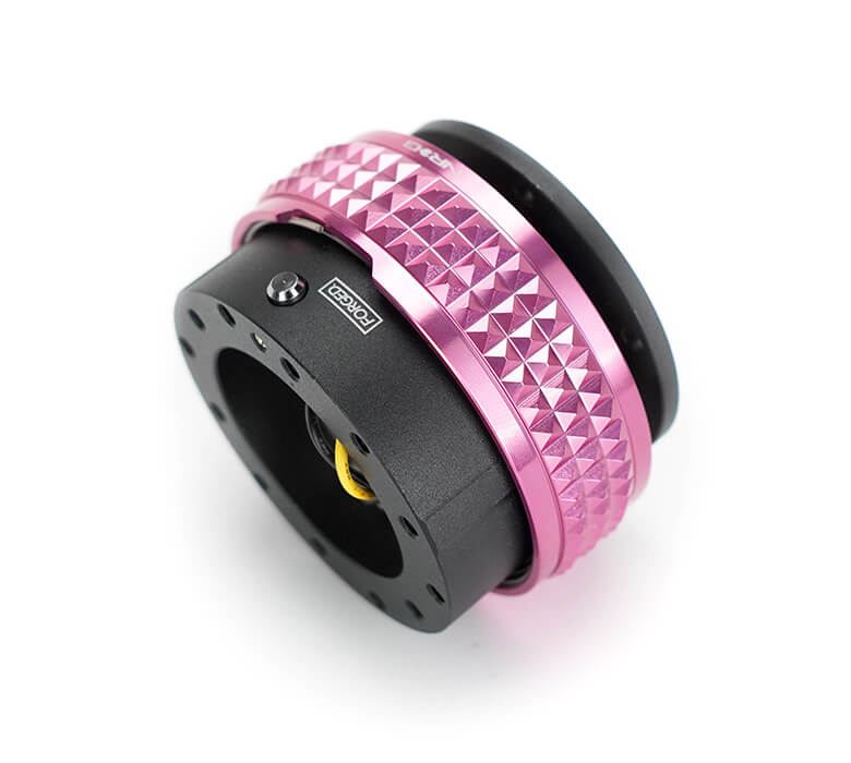 NRG Quick Release Adapter Black Body with Pink Pyramid Ring - 2.1 Pyramid Series SRK-210BK-PK, angled view highlighting detailed build and aesthetic appeal for Japanese mini trucks