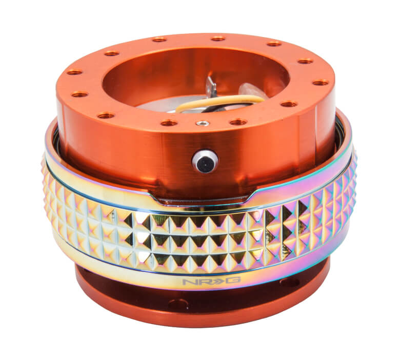 NRG Quick Release Kit with Orange Body and Neochrome Pyramid Ring - 2.1 Pyramid Series - SRK-210OR-MC, showcasing a vibrant orange base with a stylish neochrome pyramid-patterned ring designed for enhanced grip and aesthetics.