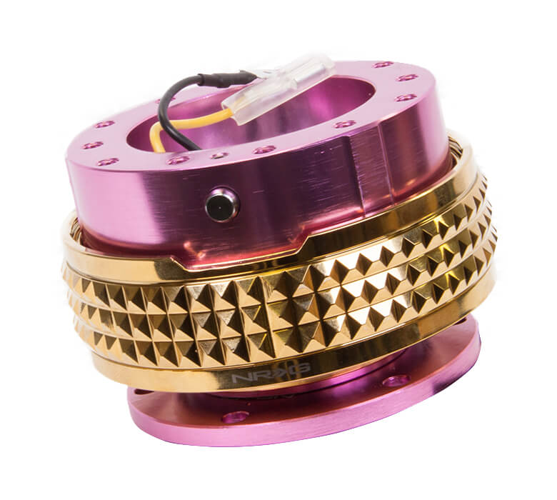 Close-up of the NRG Quick Release Kit - Pink Body / Chrome Gold Pyramid Ring - 2.1 Pyramid Series - SRK-210PK-CG, highlighting the vibrant pink color and detailed chrome gold pyramid pattern.