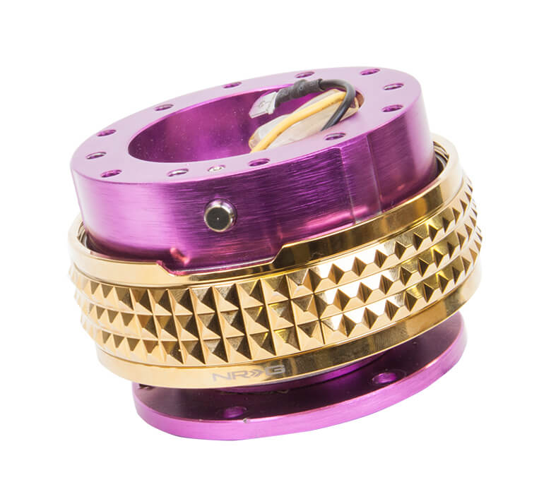 Close-up of the NRG Quick Release Kit - Purple Body / Chrome Gold Pyramid Ring - 2.1 Pyramid Series - SRK-210PP-CG, highlighting the vibrant purple color and detailed chrome gold pyramid pattern.