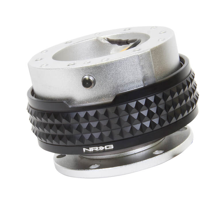 Close-up of the NRG Quick Release Kit - Silver Body / Black Pyramid Ring - 2.1 Pyramid Series - SRK-210SL-BK, highlighting the vibrant silver color and detailed black pyramid pattern.